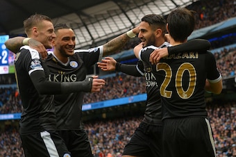 MANCHESTER, ENGLAND - FEBRUARY 06:  Riyad Mahrez (2nd R) of Leicester City celebrates scoring his team's second goal with his team mates Shinji Okazaki (1st R), Danny Simpson (2nd L) and Jamie Vardy (1st L) during the Barclays Premier League match between