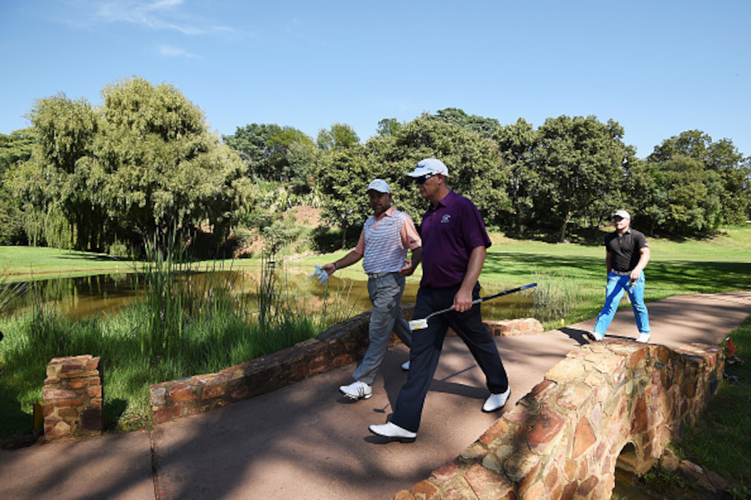 PRETORIA, SOUTH AFRICA - FEBRUARY 12:  Hennie Otto of South Africa walks over a brideg with David Drysdale of Scotlandt during the second round of the Tshwane Open at Pretoria Country Club on February 12, 2016 in Pretoria, South Africa.  (Photo by Stuart 