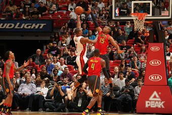 MIAMI, FL - JANUARY 31:  Chris Bosh #1 of the Miami Heat shoots the ball against Al Horford #15 of the Atlanta Hawks on January 31, 2016 at American Airlines Arena in Miami, Florida. NOTE TO USER: User expressly acknowledges and agrees that, by downloadin