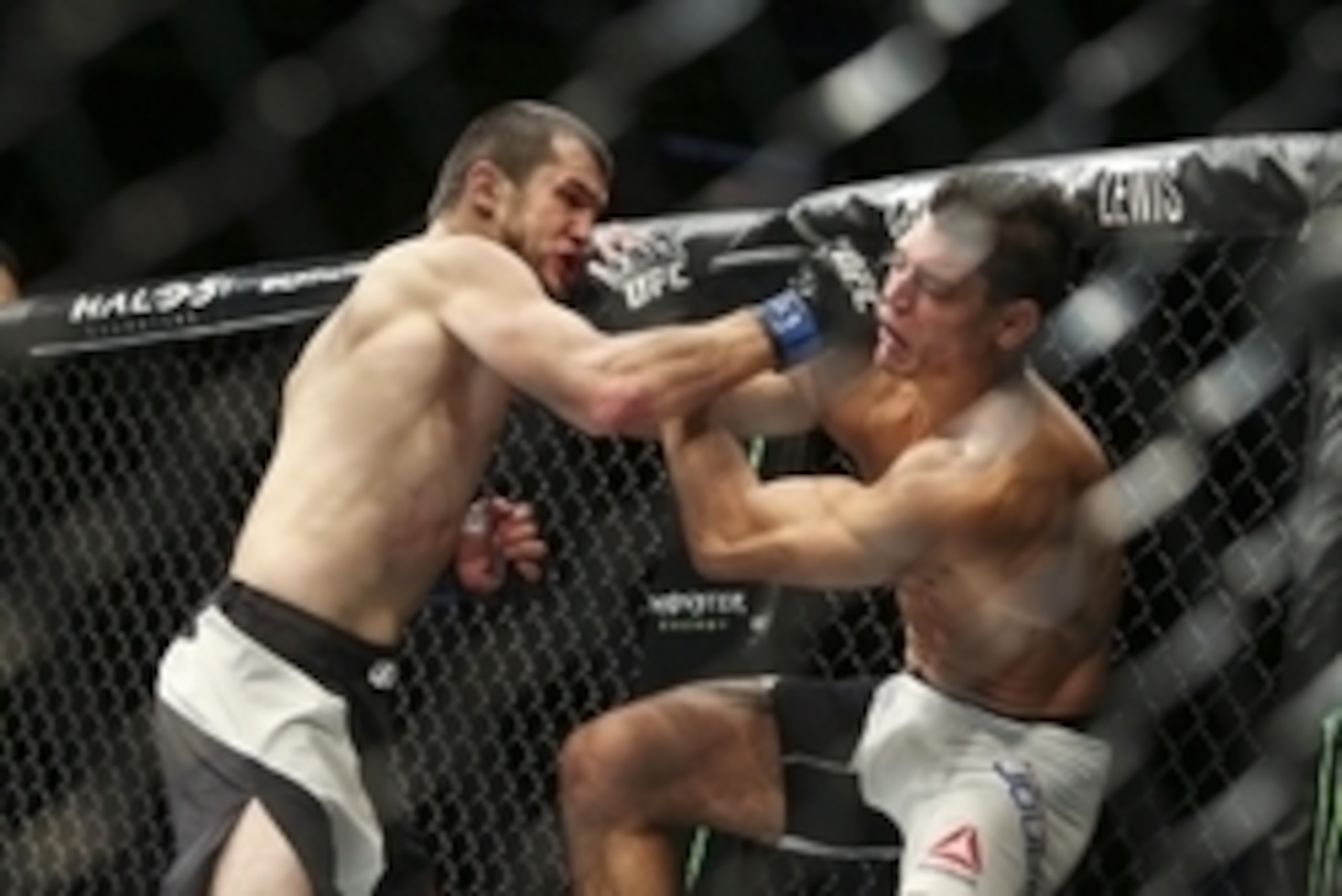 Oct 3, 2015; Houston, TX, USA; Alan Jouban (red gloves) competes against Albert Tumenov (blue gloves) during their welterweight bout at UFC 192 at Toyota Center. Mandatory Credit: Troy Taormina-USA TODAY Sports