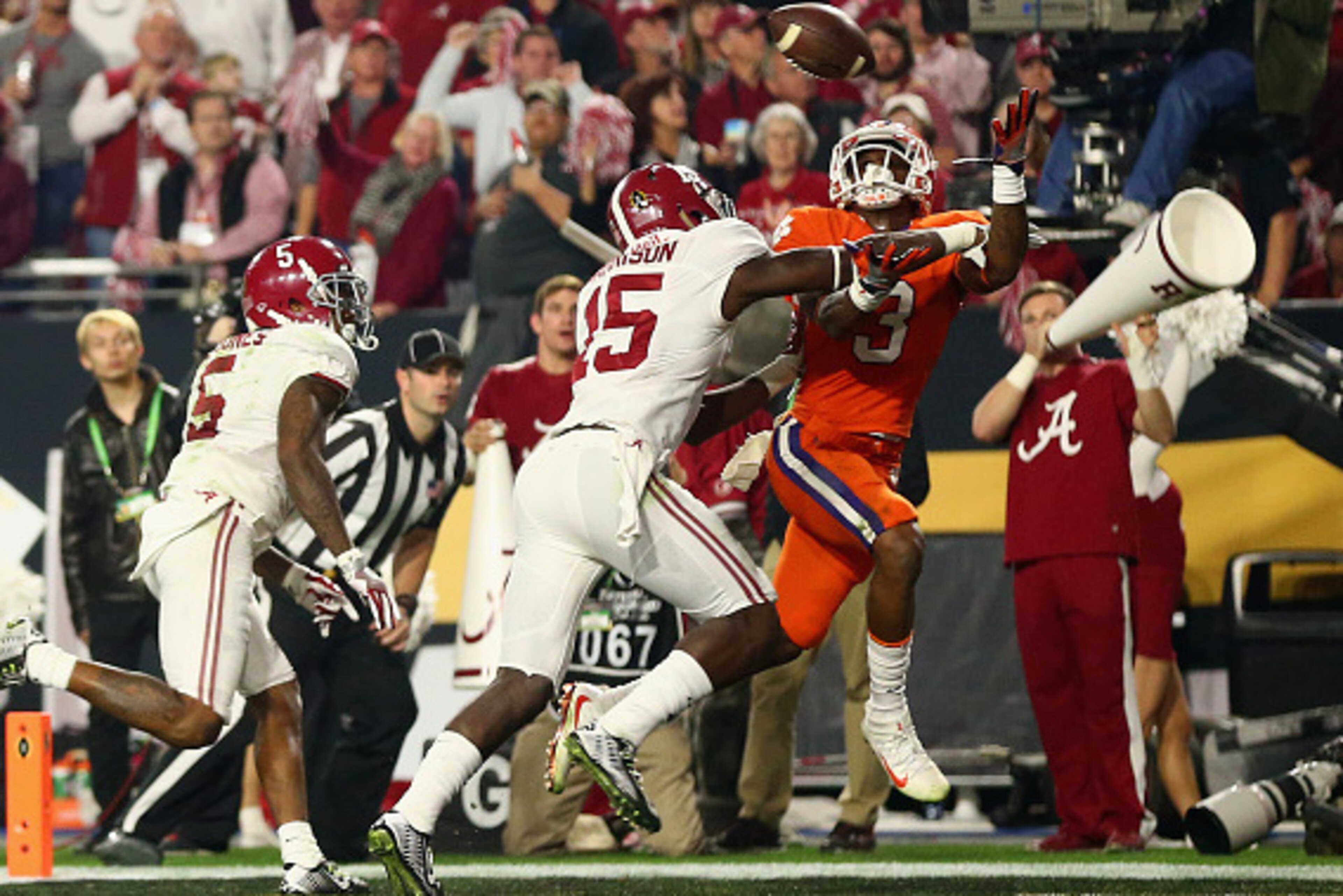 GLENDALE, AZ - JANUARY 11:  Artavis Scott #3 of the Clemson Tigers attempts to catch an end zone pass broken up by Ronnie Harrison #15 of the Alabama Crimson Tide in the third quarter during the 2016 College Football Playoff National Championship Game at 