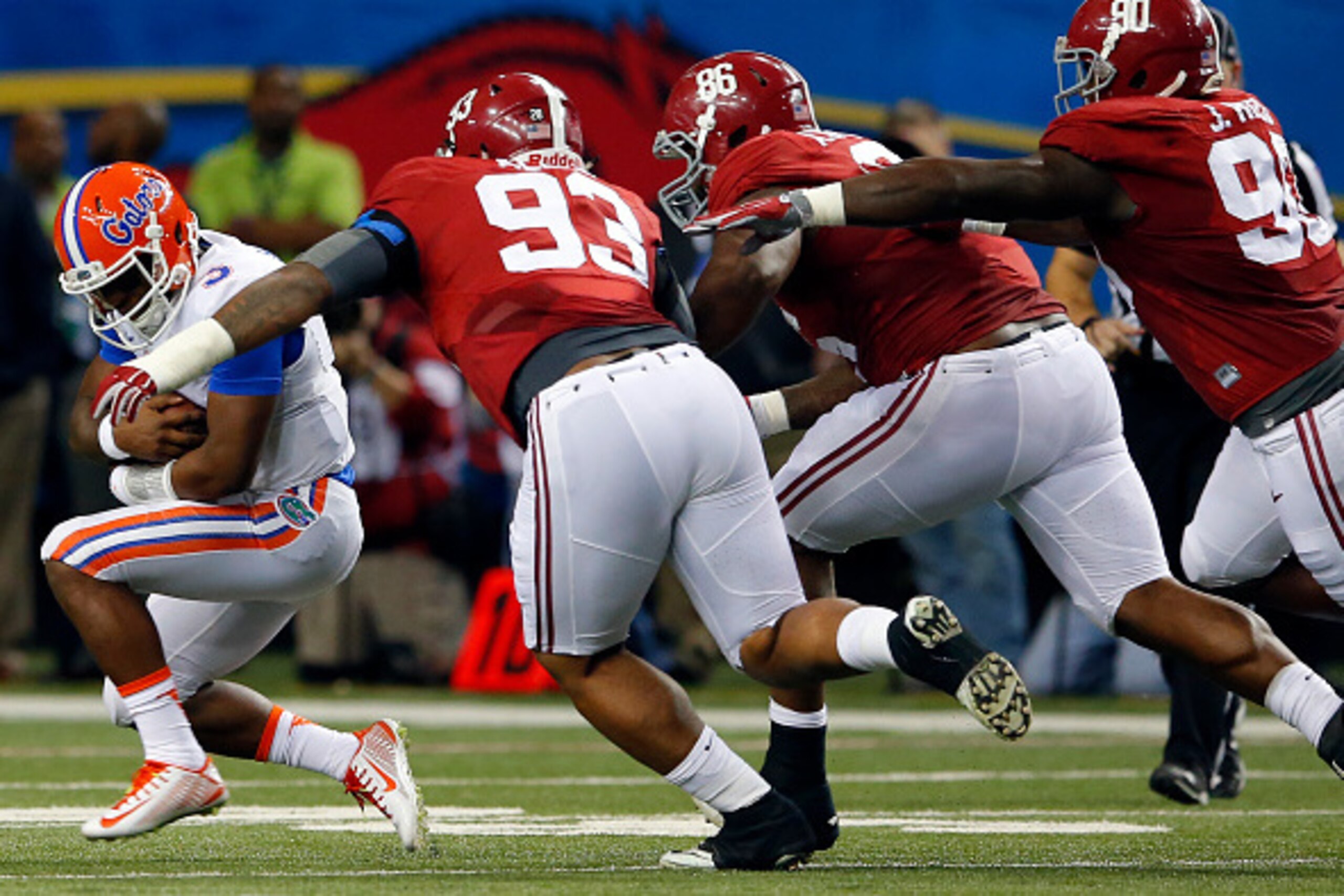 ATLANTA, GA - DECEMBER 5: Quarterback Treon Harris #3 of the Florida Gators is sacked by defensive lineman Jonathan Allen #93 of the Alabama Crimson Tide, defensive lineman A'Shawn Robinson #86 of the Alabama Crimson Tide, and defensive lineman Jarran Ree