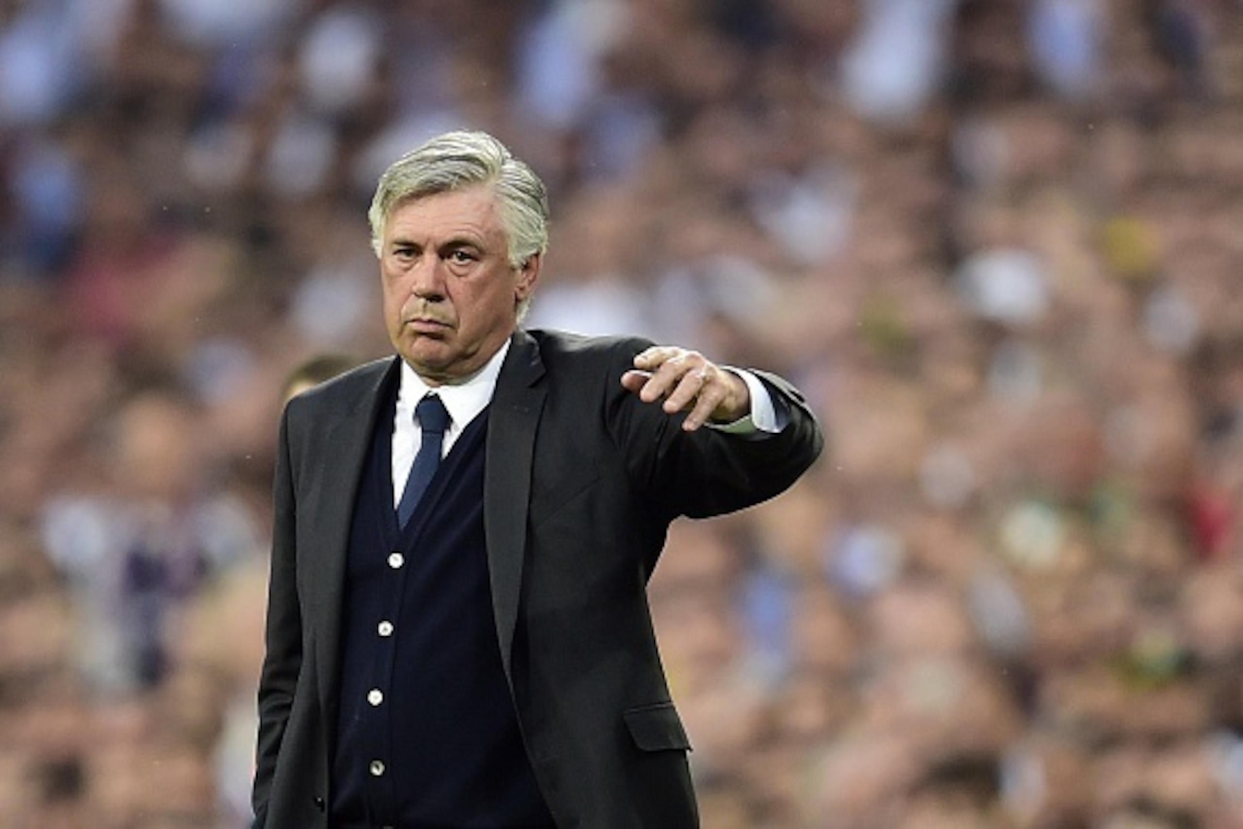 Real Madrid's Italian coach Carlo Ancelotti gestures during the UEFA Champions League semi-final second leg football match Real Madrid FC vs Juventus at the Santiago Bernabeu stadium in Madrid on May 13, 2015. AFP PHOTO/ GERARD JULIEN (Photo cred Real Madrid's Italian coach Carlo Ancelotti gestures during the UEFA Champions League semi-final second leg football match Real Madrid FC vs Juventus at the Santiago Bernabeu stadium in Madrid on May 13, 2015. AFP PHOTO/ GERARD JULIEN (Photo cred