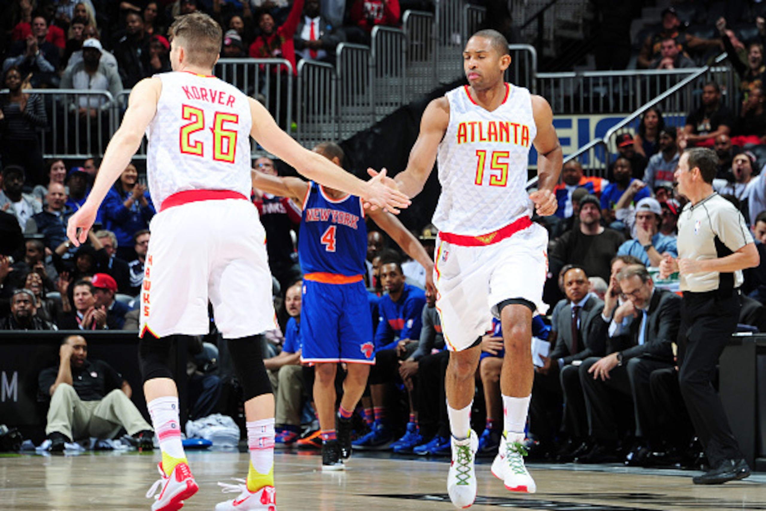 ATLANTA, GA - JANUARY 5: Al Horford #15 high fives teammate Kyle Korver #26 of the Atlanta Hawks during the game against the New York Knicks on January 5, 2016 at Philips Arena in Atlanta, Georgia. NOTE TO USER: User expressly acknowledges and agrees that ATLANTA, GA - JANUARY 5: Al Horford #15 high fives teammate Kyle Korver #26 of the Atlanta Hawks during the game against the New York Knicks on January 5, 2016 at Philips Arena in Atlanta, Georgia. NOTE TO USER: User expressly acknowledges and agrees that