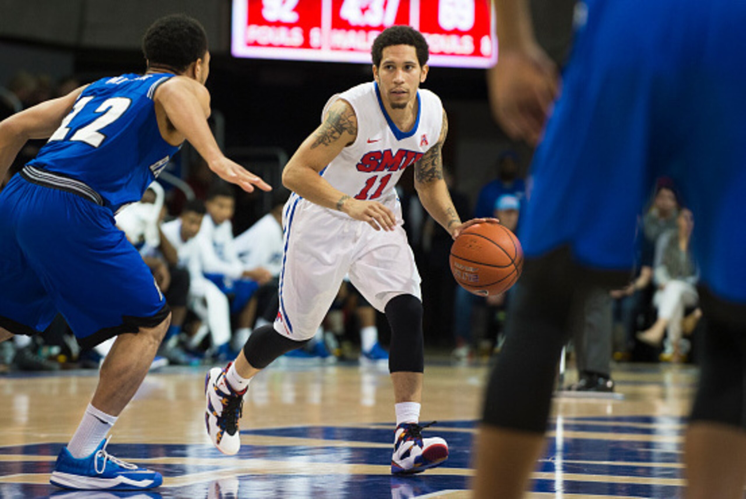 DALLAS, TX - DECEMBER 17: Nic Moore #11 of the SMU Mustangs brings the ball up court against the Hampton Pirates on December 17, 2015 at Moody Coliseum in Dallas, Texas.  (Photo by Cooper Neill/Getty Images)