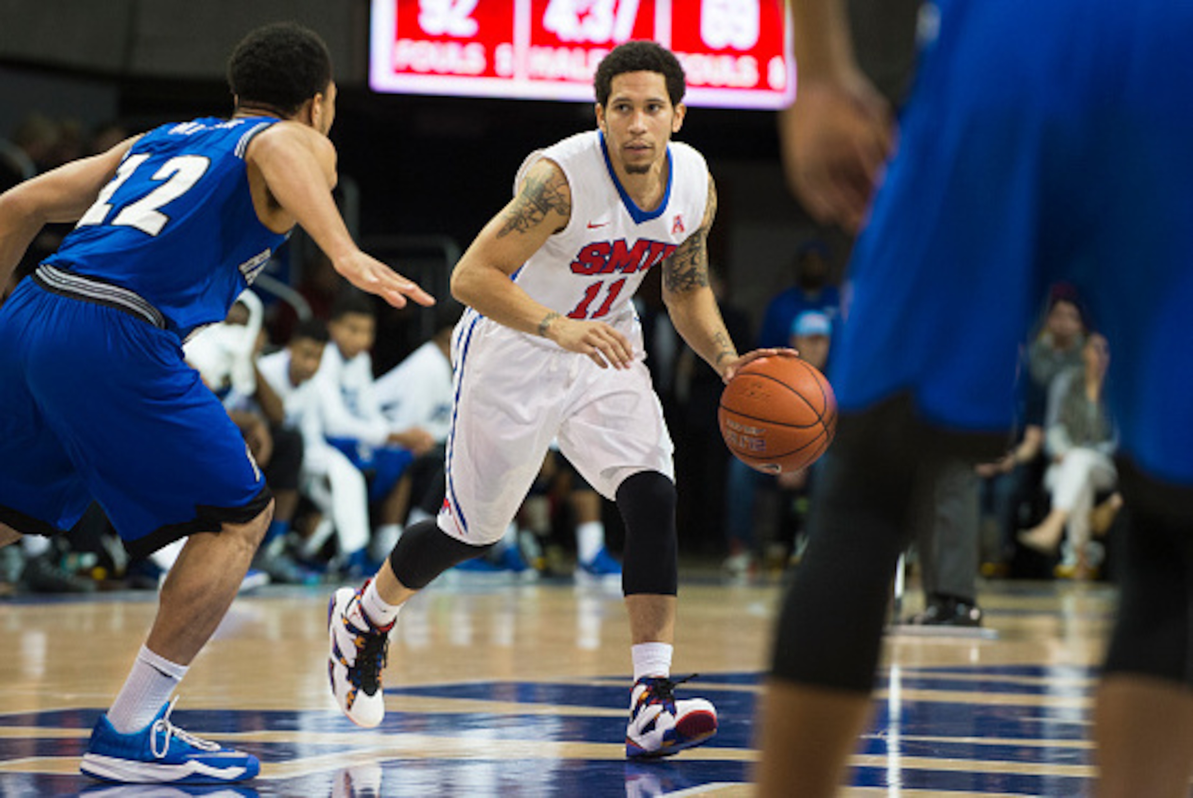 DALLAS, TX - DECEMBER 17: Nic Moore #11 of the SMU Mustangs brings the ball up court against the Hampton Pirates on December 17, 2015 at Moody Coliseum in Dallas, Texas.  (Photo by Cooper Neill/Getty Images)