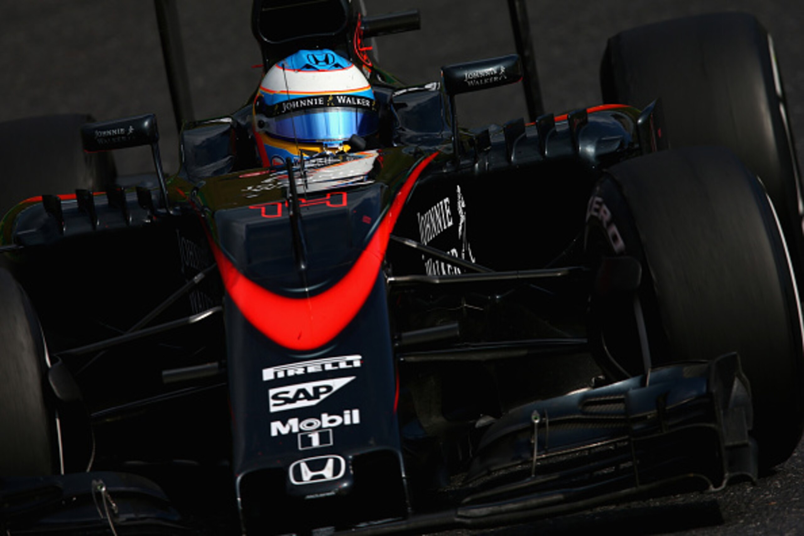 SUZUKA, JAPAN - SEPTEMBER 27:  Fernando Alonso of Spain and McLaren Honda drives during the Formula One Grand Prix of Japan at Suzuka Circuit on September 27, 2015 in Suzuka, Japan.  (Photo by Clive Mason/Getty Images)