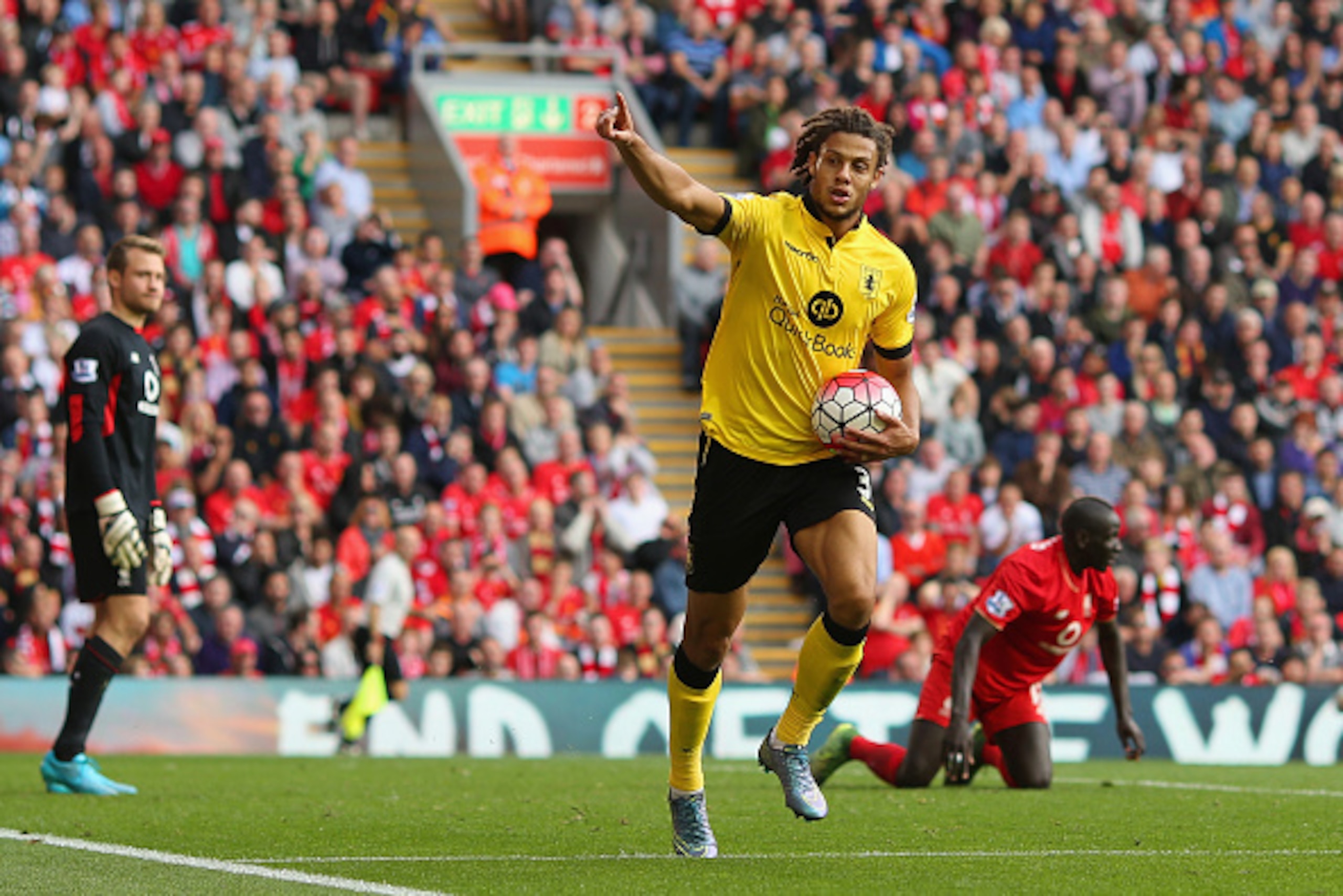 LIVERPOOL, ENGLAND - SEPTEMBER 26:  Rudy Gestede of Aston Villa celebrates scoring his team's second goal during the Barclays Premier League match between Liverpool and Aston Villa at Anfield on September 26, 2015 in Liverpool, United Kingdom.  (Photo by 