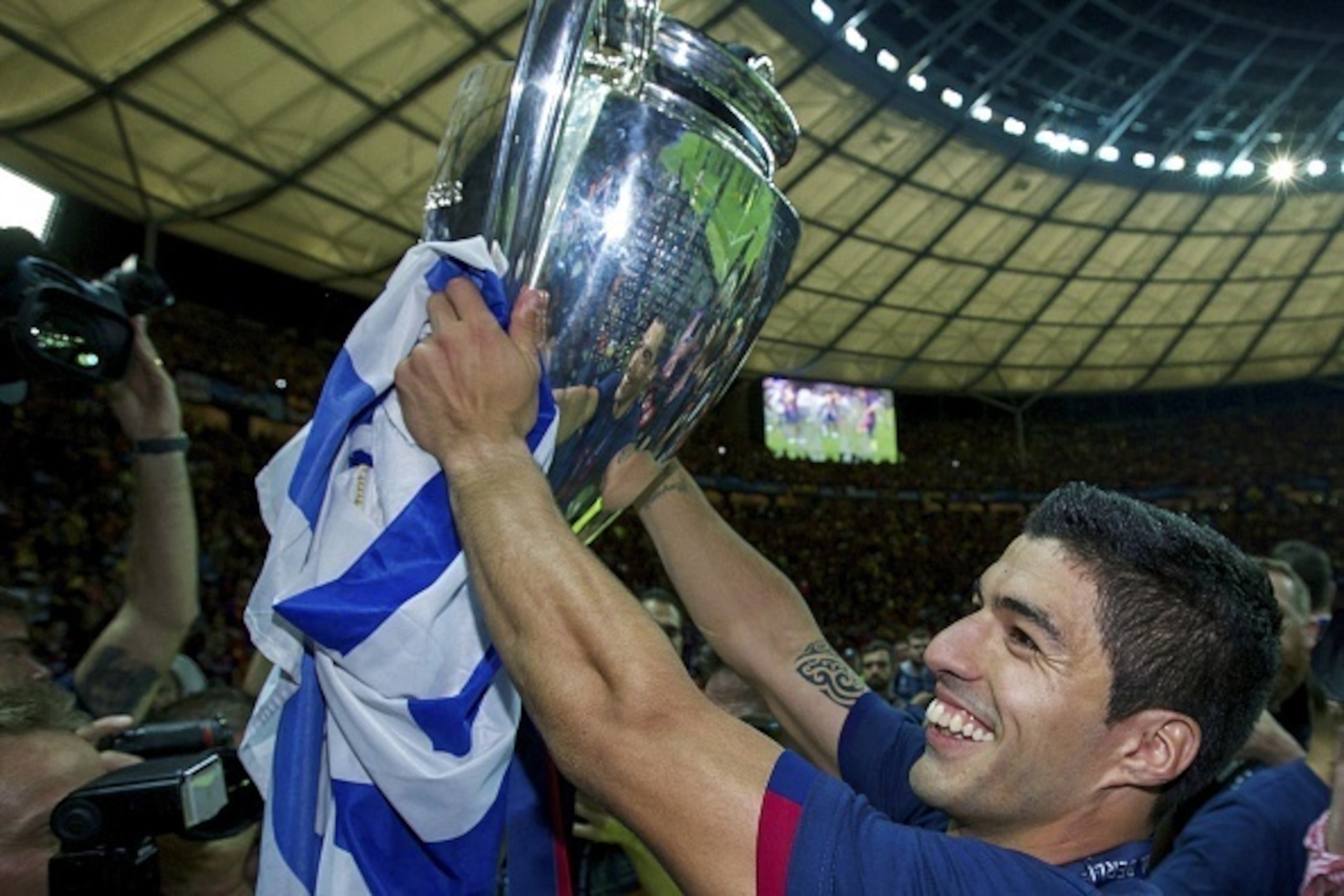 Luis Suarez of FC Barcelona with Champions League trophy during the UEFA Champions League  final match between Barcelona and Juventus on June 6, 2015 at the Olympic stadium in Berlin, Germany.(Photo by VI Images via Getty Images)