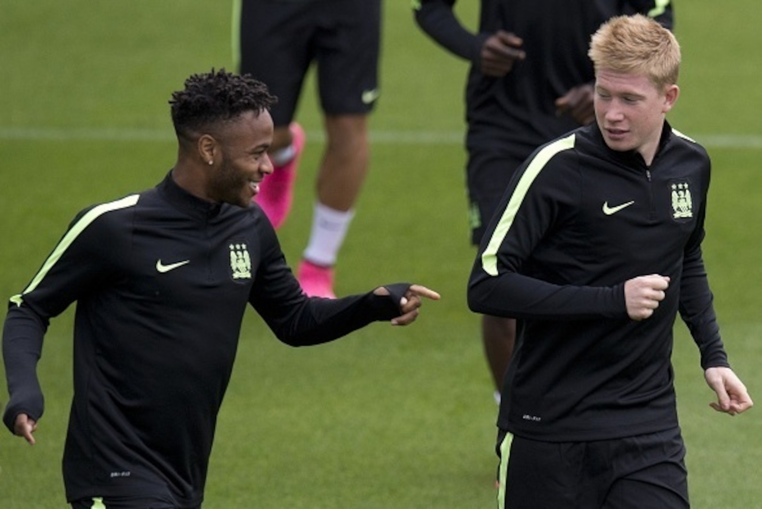 Manchester City's English midfielder Raheem Sterling (L) and Manchester City's Belgian midfielder Kevin De Bruyne (R) take part in a training session at the club's 'City Football Academy' training facility in Manchester, north west England on September 14