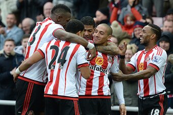 Sunderland's French-born Tunisian midfielder Wahbi Khazri (2R) celebrates scoring his team's first goal with teammates during the English Premier League football match between Sunderland and Manchester United at the Stadium of Light in Sunderland, northea