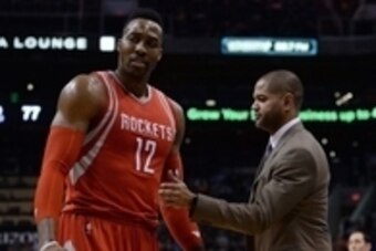 Feb 4, 2016; Phoenix, AZ, USA;  Houston Rockets center Dwight Howard (12) and head coach J.B. Bickerstaff interact at Talking Stick Resort Arena. Mandatory Credit: Jennifer Stewart-USA TODAY Sports