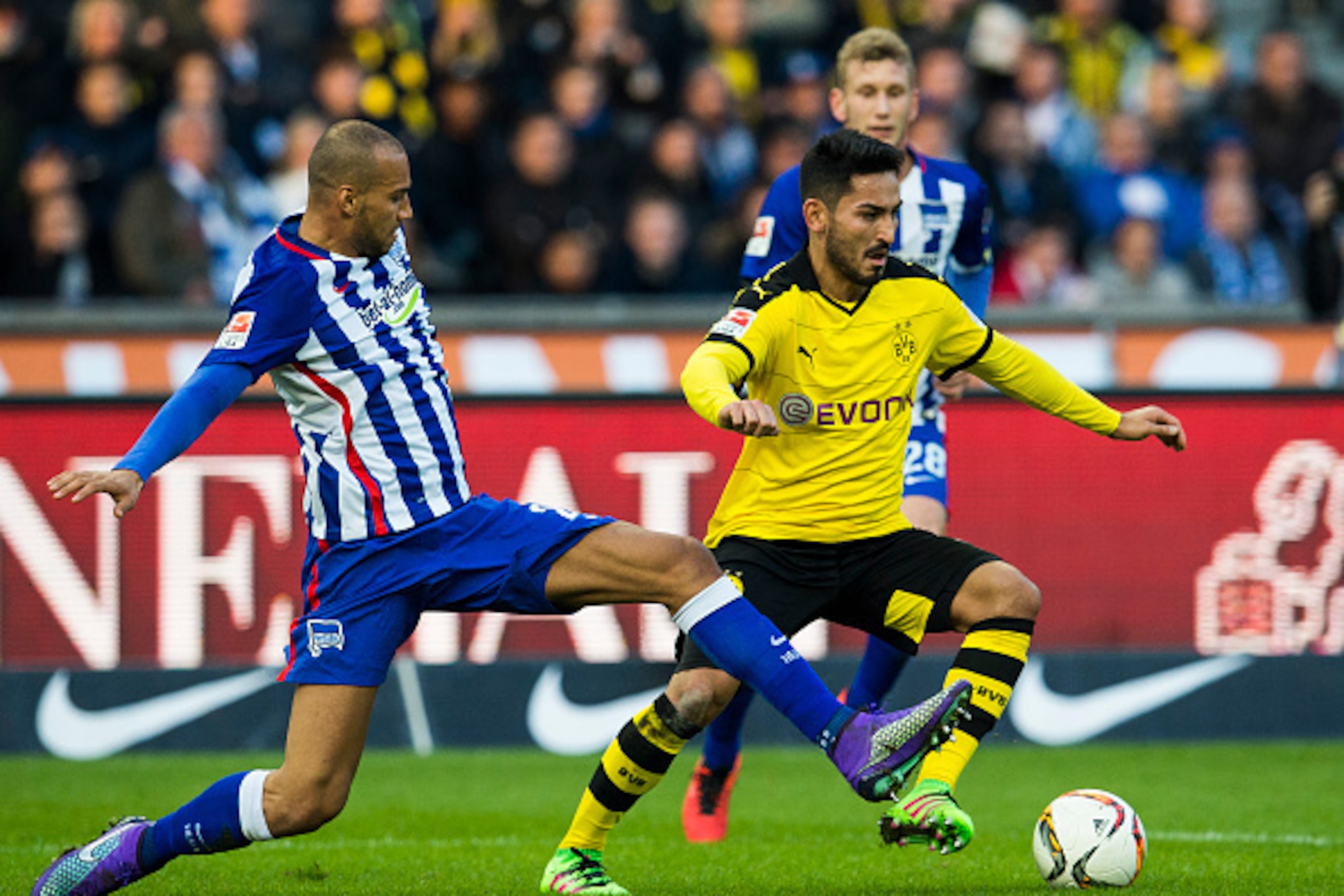 Dortmund's midfileder Ilkay Guendogan (R) and Hertha Berlin's US defender John Anthony Brooks vie for the ball during the German first division Bundesliga football match, Hertha Berlin v Borussia Dortmund, at the Olympic stadium in Berlin on February 6, 2
