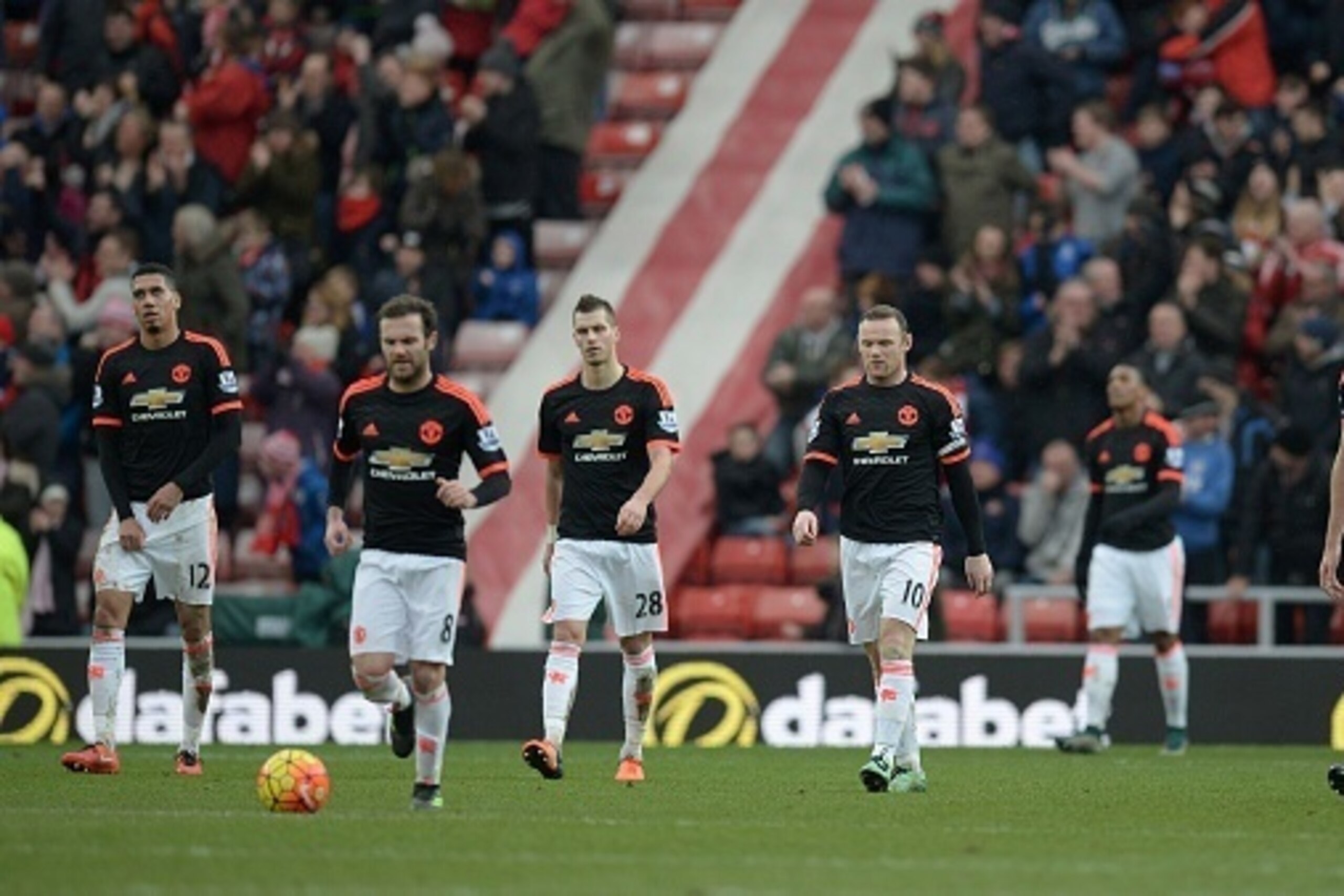 Manchester United's English striker Wayne Rooney (C) leads his teammates off of the pitch following the English Premier League football match between Sunderland and Manchester United at the Stadium of Light in Sunderland, northeast England on February 13, Manchester United's English striker Wayne Rooney (C) leads his teammates off of the pitch following the English Premier League football match between Sunderland and Manchester United at the Stadium of Light in Sunderland, northeast England on February 13,