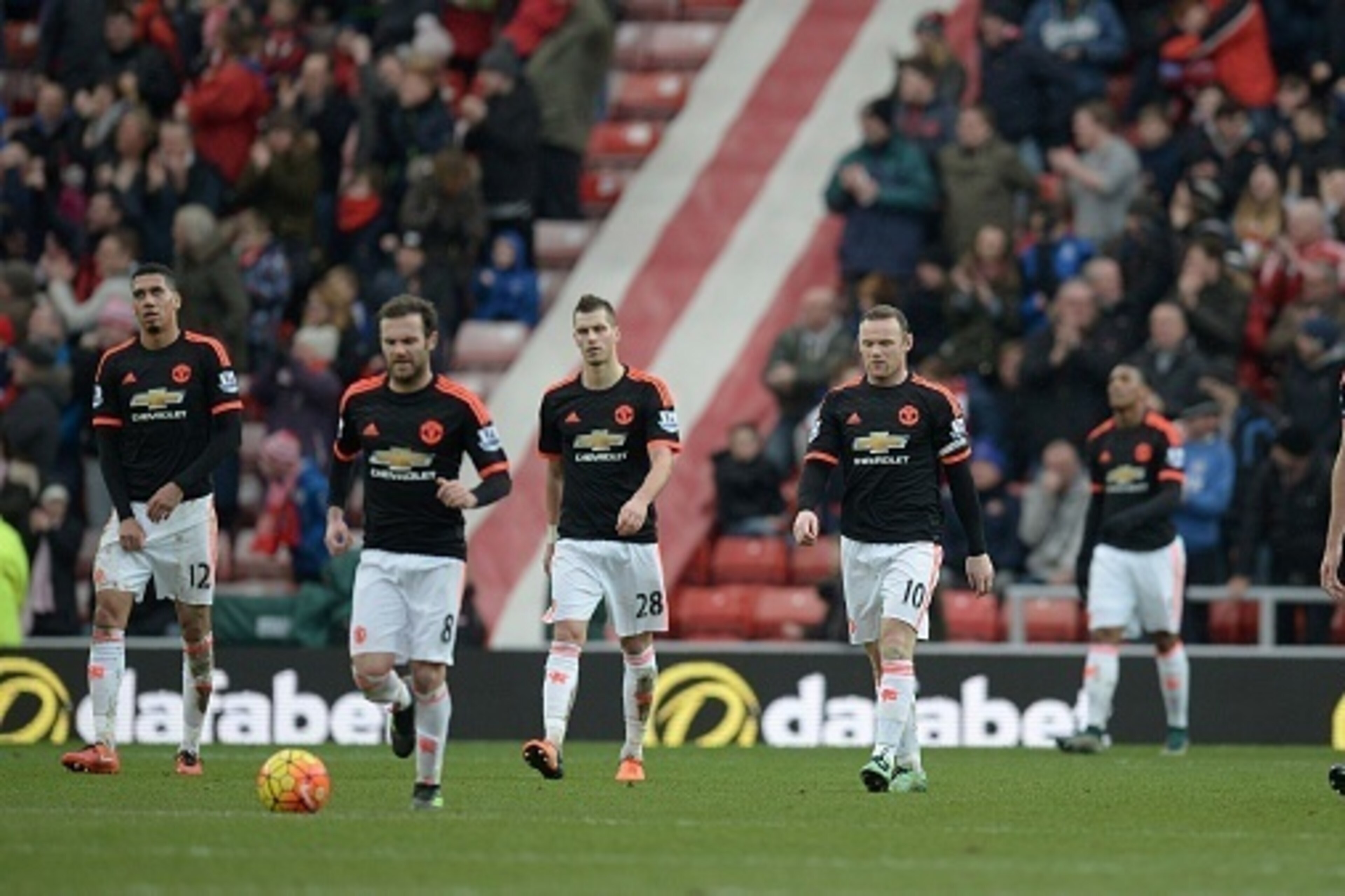 Manchester United's English striker Wayne Rooney (C) leads his teammates off of the pitch following the English Premier League football match between Sunderland and Manchester United at the Stadium of Light in Sunderland, northeast England on February 13, Manchester United's English striker Wayne Rooney (C) leads his teammates off of the pitch following the English Premier League football match between Sunderland and Manchester United at the Stadium of Light in Sunderland, northeast England on February 13,
