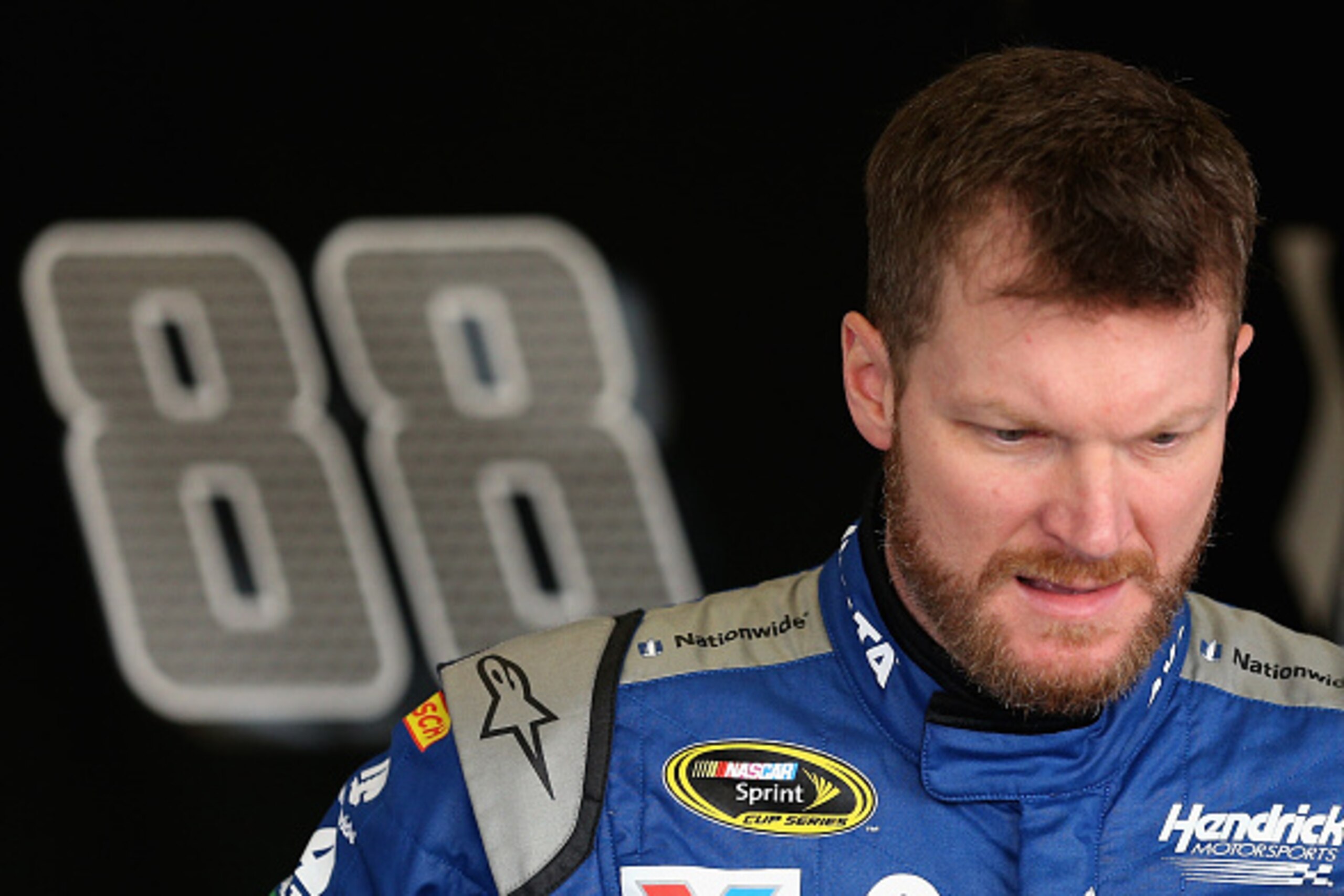 DAYTONA BEACH, FL - FEBRUARY 13: Dale Earnhardt Jr., driver of the #88 Nationwide Chevrolet, looks on in the garage area during practice for the NASCAR Sprint Cup Series Daytona 500 at Daytona International Speedway on February 13, 2016 in Daytona Beach, DAYTONA BEACH, FL - FEBRUARY 13: Dale Earnhardt Jr., driver of the #88 Nationwide Chevrolet, looks on in the garage area during practice for the NASCAR Sprint Cup Series Daytona 500 at Daytona International Speedway on February 13, 2016 in Daytona Beach,