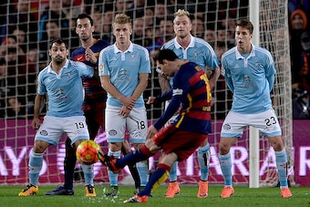 Barcelona's Argentinian forward Lionel Messi shoots a free kick to score a goal during the Spanish league football match FC Barcelona vs RC Celta de Vigo at the Camp Nou stadium in Barcelona on February 14, 2016.

 / AFP / JOSEP LAGO        (Photo credit 