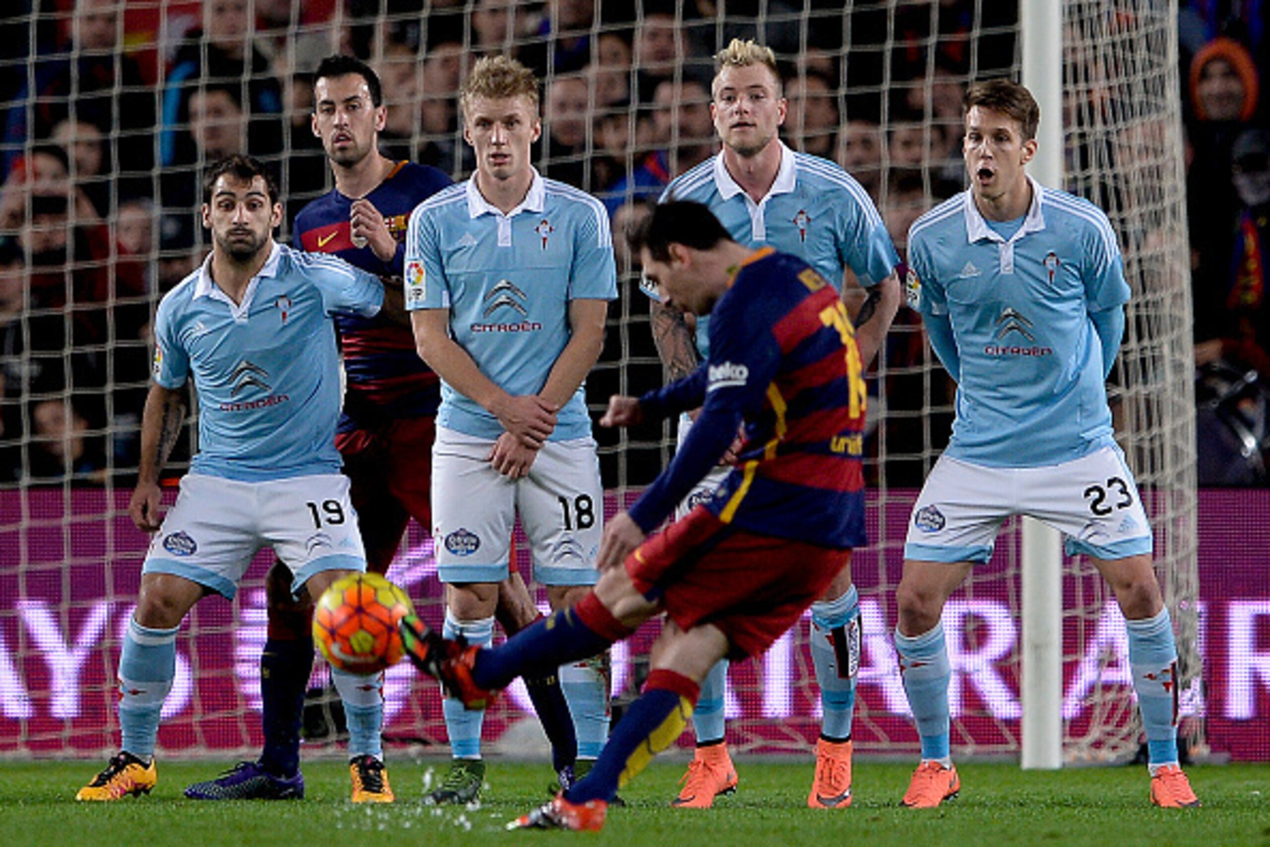 Barcelona's Argentinian forward Lionel Messi shoots a free kick to score a goal during the Spanish league football match FC Barcelona vs RC Celta de Vigo at the Camp Nou stadium in Barcelona on February 14, 2016.

 / AFP / JOSEP LAGO        (Photo credit 