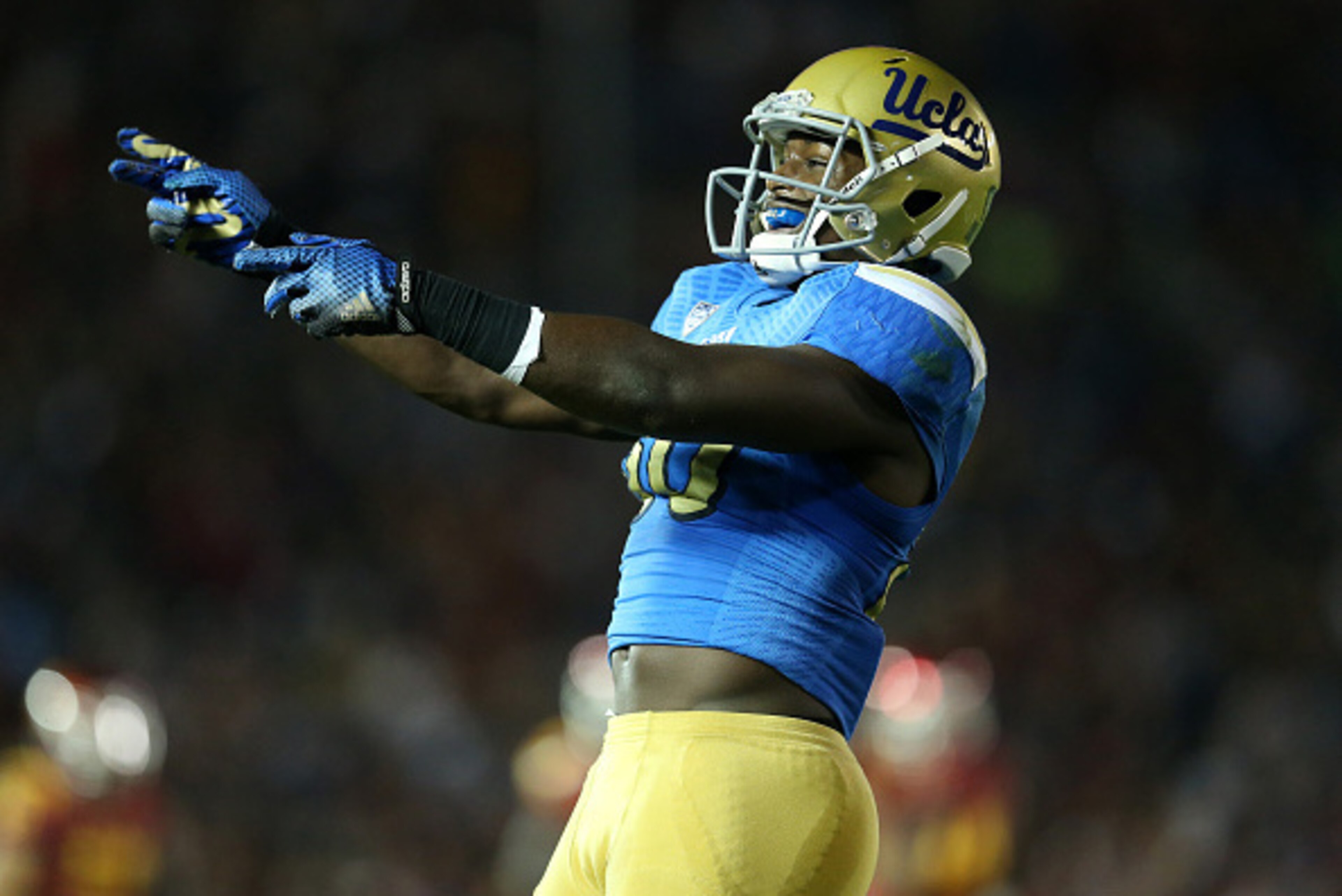 PASADENA, CA - NOVEMBER 22:   Linebacker Myles Jack #30 of the UCLA Bruins celebrates after the Bruins stopped the USC Trojans on fourth down on the five yard line to take over on downs on the final play of the first quarter at the Rose Bowl on November 2