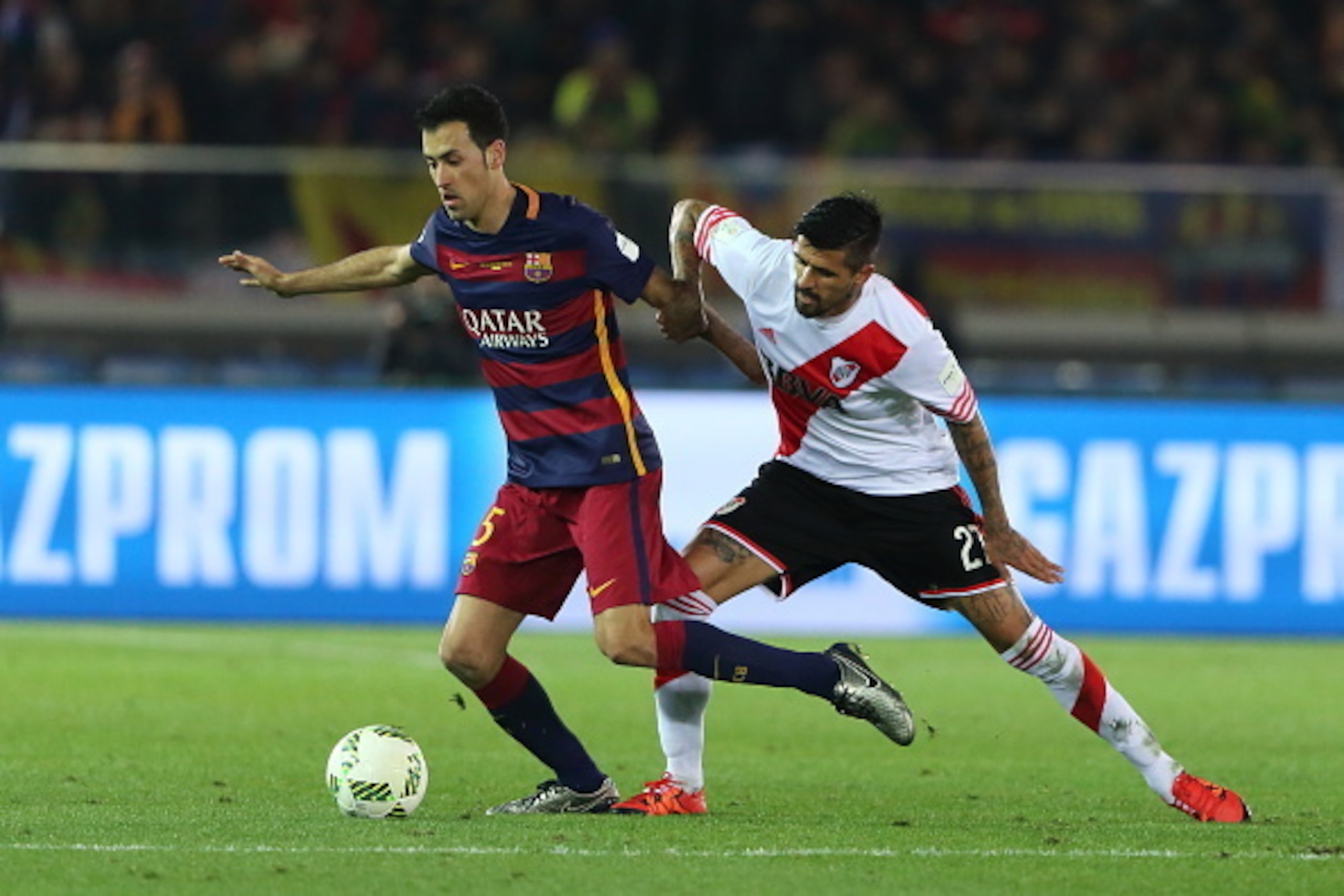 YOKOHAMA, JAPAN - DECEMBER 20:  Sergio Busquets of FC Barcelona and Luis Gonzalez of River Plate during the FIFA Club World Cup Final Match between FC Barcelona and River Plate at International Stadium Yokohama on December 20, 2015 in Yokohama, Japan.  (P