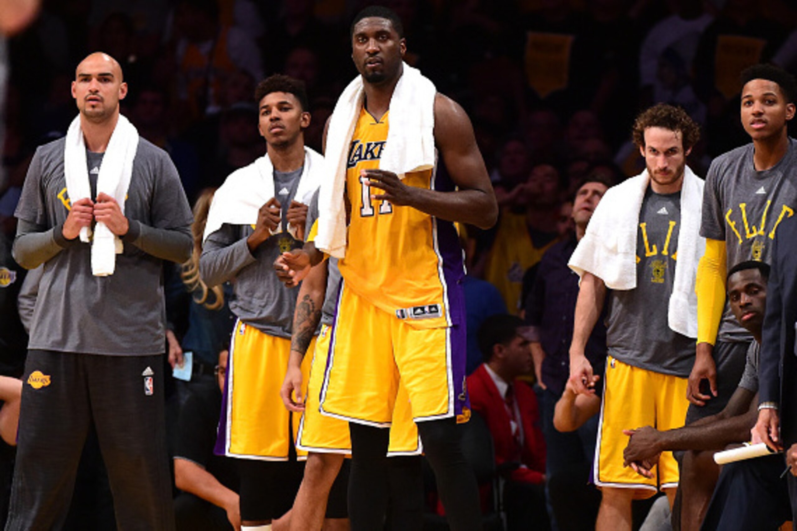 LOS ANGELES, CA - OCTOBER 28:  (L-R) Robert Sacre #50, Nick Young #0, Roy Hibbert #17 and Marcelo Huertas #9 of the Los Angeles Lakers watch play during a 112-111 loss to the Minnesota Timberwolves at Staples Center on October 28, 2015 in Los Angeles, Cal