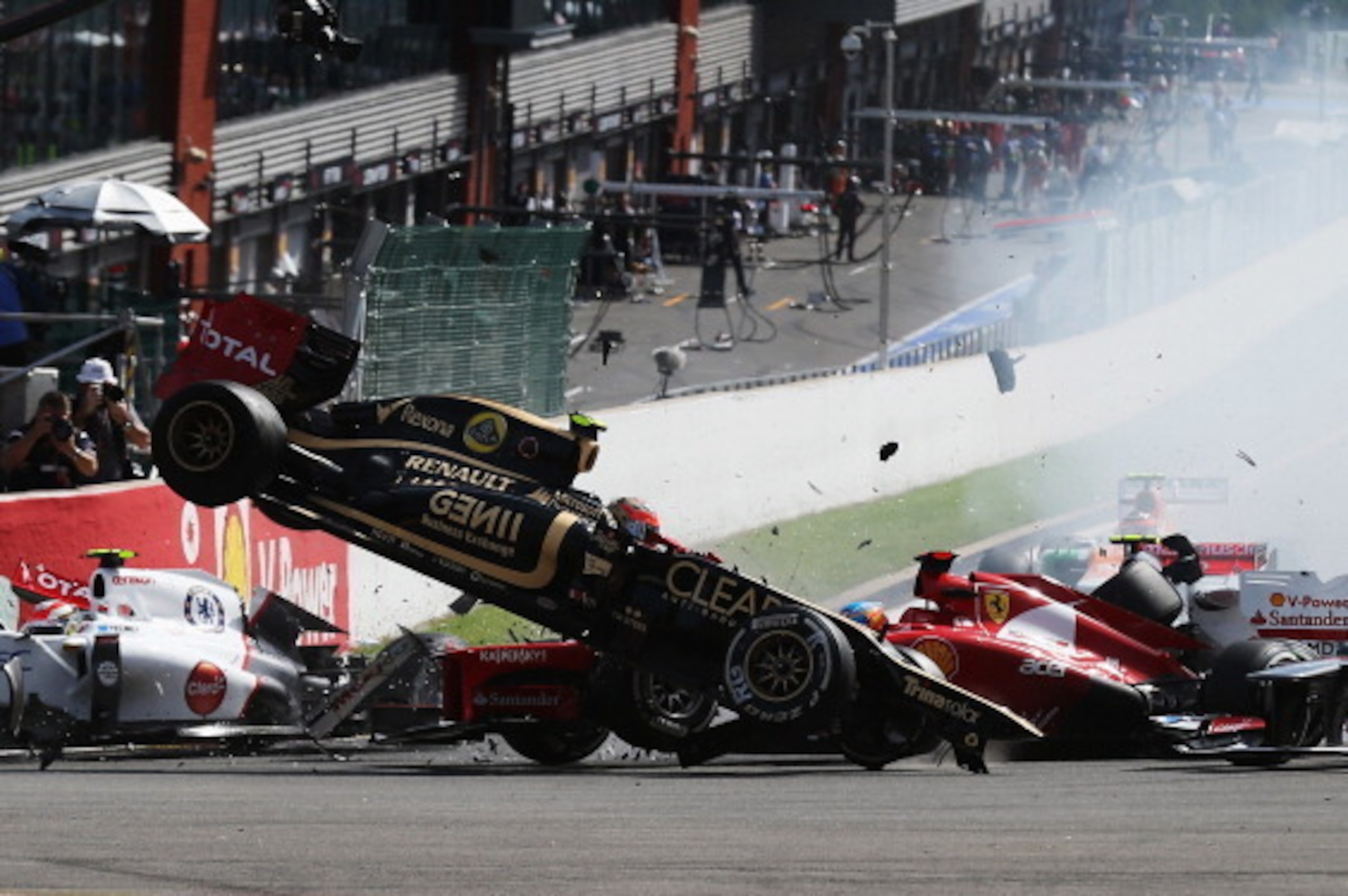 SPA, BELGIUM - SEPTEMBER 02:  In this sequence of ten frames Romain Grosjean of France and Lotus is seen being catapulted into the air as he crashes at the first corner at the start of the Belgian Grand Prix at the Circuit of Spa Francorchamps on Septembe