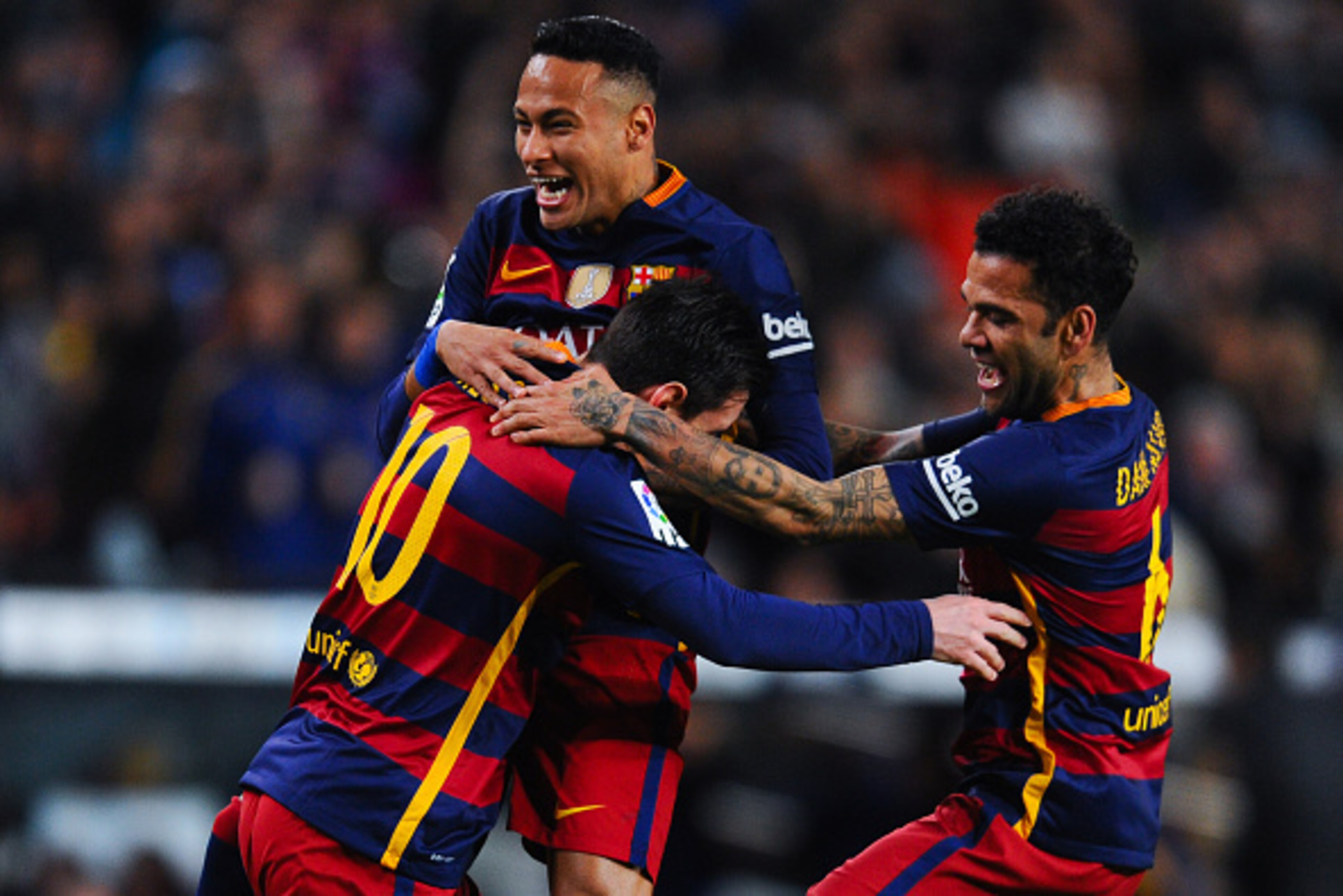 BARCELONA, SPAIN - FEBRUARY 14:  Lionel Messi of FC Barcelona celebrates with his teammates Neymar and Dani Alves of FC Barcelona after scoring the opening goal during the La Liga match between FC Barcelona and Celta Vigo at Camp Nou on February 14, 2016 