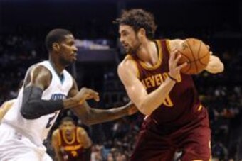 Feb 3, 2016; Charlotte, NC, USA; Cleveland Cavaliers forward center Kevin Love (0) looks to pass as he is defended by Charlotte Hornets forward Marvin Williams (2) during the first half of the game at Time Warner Cable Arena. Mandatory Credit: Sam Sharpe-