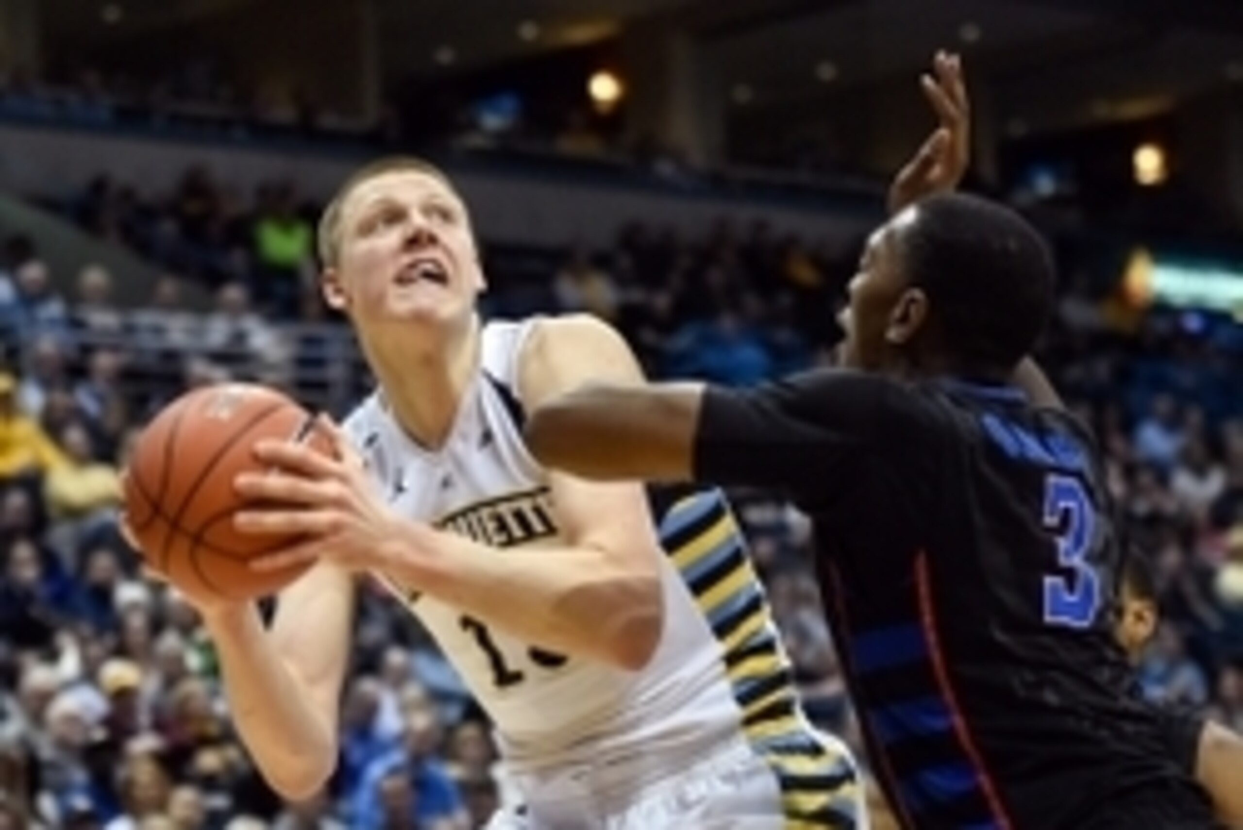 Jan 20, 2016; Milwaukee, WI, USA;  Marquette Golden Eagles forward Henry Ellenson (13) looks for a shot against DePaul Blue Demons forward Rashaun Stimage (3) at BMO Harris Bradley Center. Mandatory Credit: Benny Sieu-USA TODAY Sports