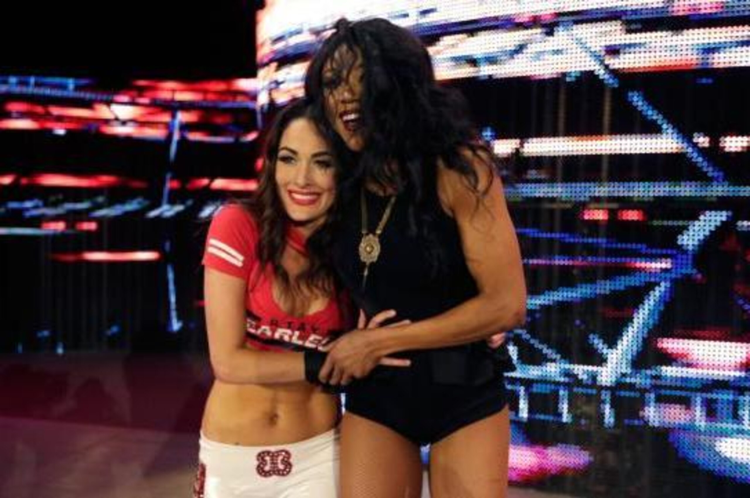 Brie Bella celebrates with Alicia Fox. Brie Bella celebrates with Alicia Fox.