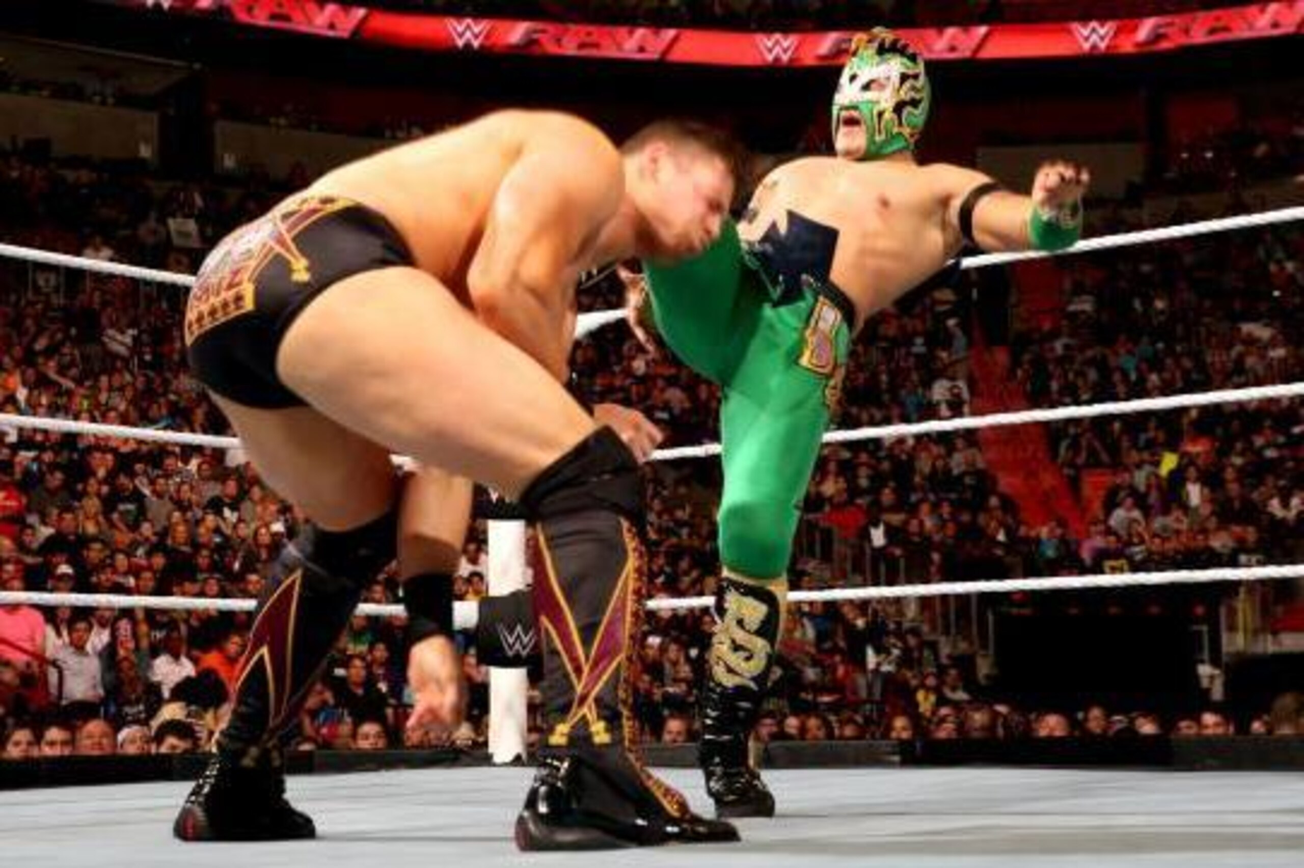 Kalisto kicks The Miz in a battle on Raw.