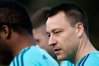 Chelsea's English defender John Terry (R) walks to the football pitches to take part in a training session at the club's complex in Cobham, Surrey on February 15, 2016.
Chelsea play Paris St-Germain in the last-16 round of matches in the Champions League 