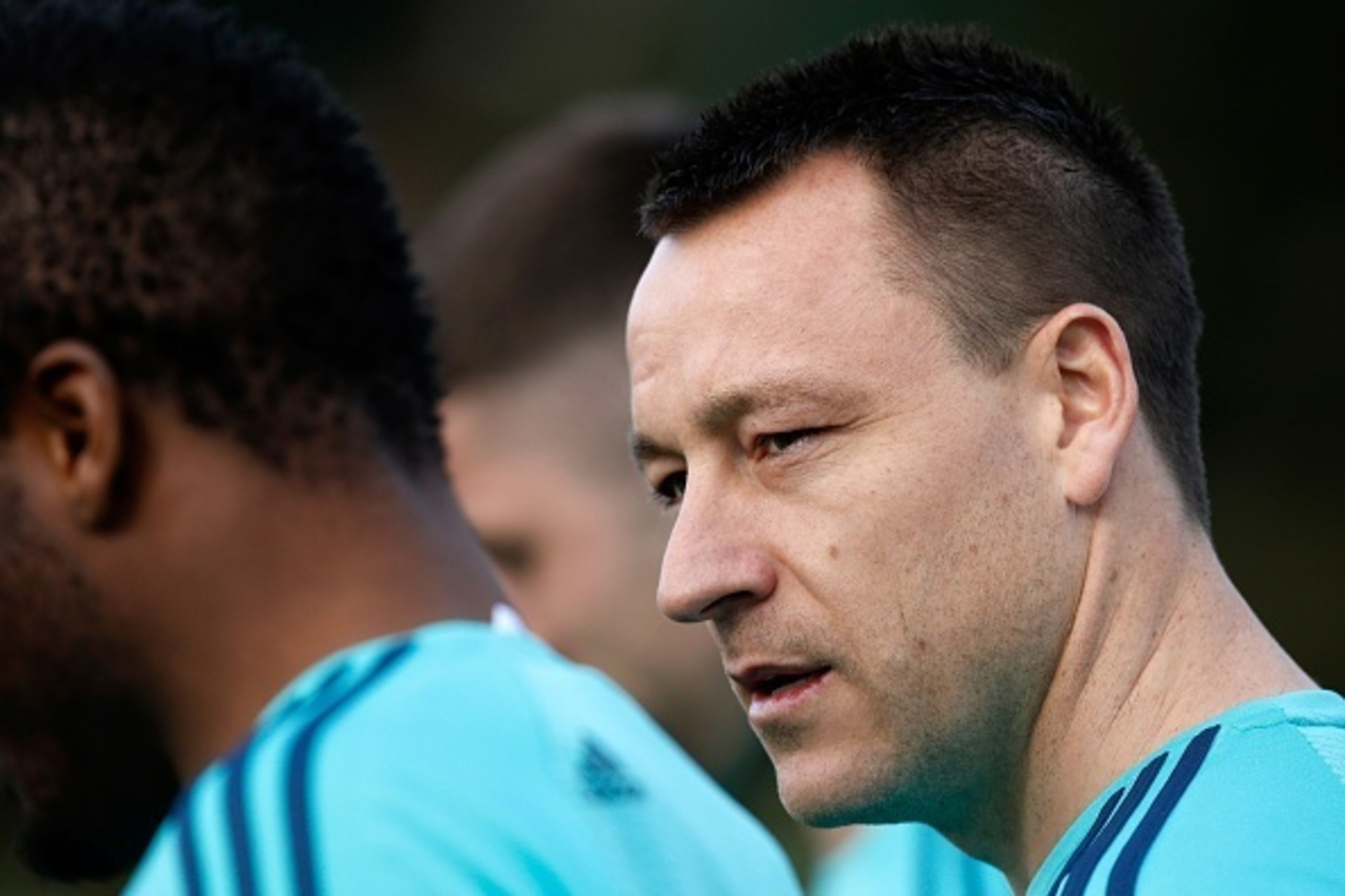 Chelsea's English defender John Terry (R) walks to the football pitches to take part in a training session at the club's complex in Cobham, Surrey on February 15, 2016.
Chelsea play Paris St-Germain in the last-16 round of matches in the Champions League 