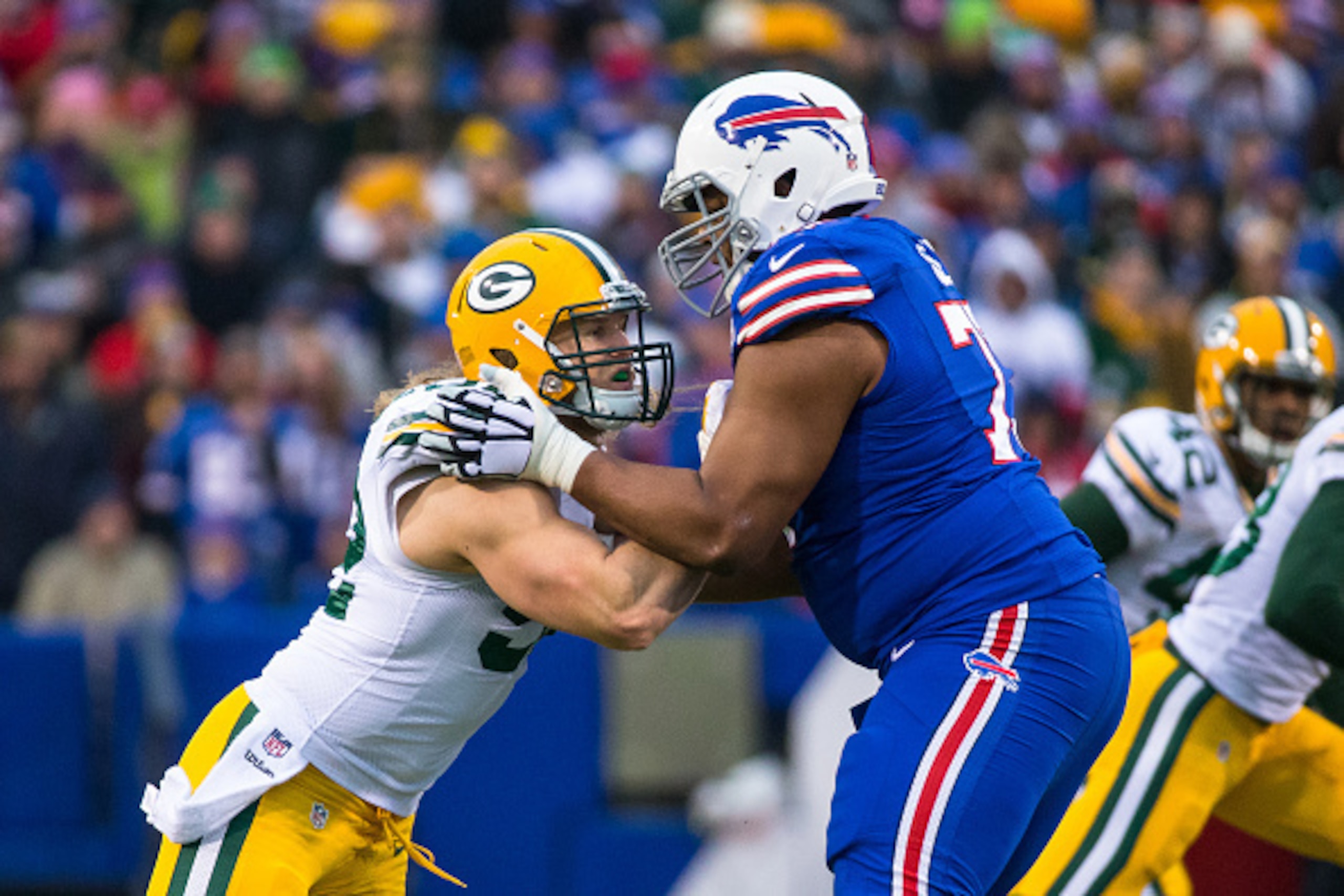 ORCHARD PARK, NY - DECEMBER 14: Clay Matthews #52 of the Green Bay Packers clashes with Cordy Glenn #77 of the Buffalo Bills on December 14, 2014 at Ralph Wilson Stadium in Orchard Park, New York. Buffalo defeat Green Bay 21-13. (Photo by Brett Carlsen ORCHARD PARK, NY - DECEMBER 14: Clay Matthews #52 of the Green Bay Packers clashes with Cordy Glenn #77 of the Buffalo Bills on December 14, 2014 at Ralph Wilson Stadium in Orchard Park, New York. Buffalo defeat Green Bay 21-13. (Photo by Brett Carlsen