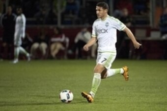 Feb 6, 2016; Tucson, AZ, USA; Seattle Sounders midfielder Cristian Roldan (7) dribbles the ball during the first half against the Portland Timbers at Kino North Stadium. Portland won 2-1. Mandatory Credit: Casey Sapio-USA TODAY Sports