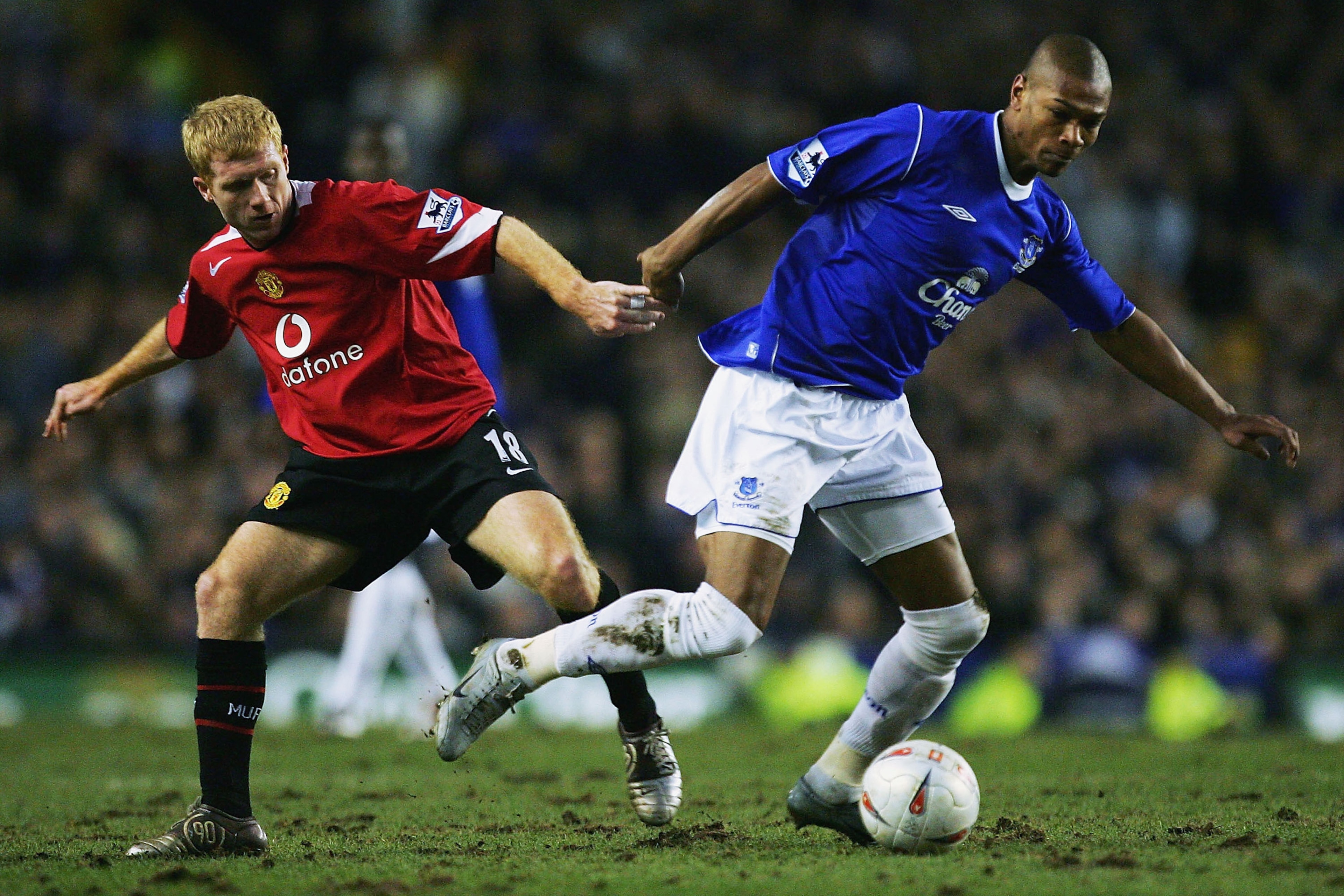 Bent takes on Manchester United's Paul Scholes in 2005.