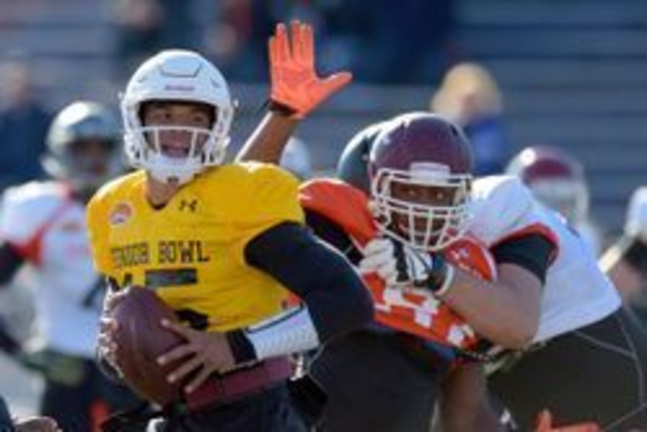 Jan 28, 2016; Mobile, AL, USA; South squad quarterback Dak Prescott of Mississippi State (15) avoids the pressure of defensive end Noah Spence of Eastern Kentucky (97) during Senior Bowl practice at Ladd-Peebles Stadium. Mandatory Credit:  Glenn Andrews-U