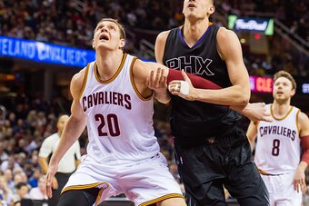 CLEVELAND, OH - JANUARY 27: Timofey Mozgov #20 of the Cleveland Cavaliers boxes out Alex Len #21 of the Phoenix Suns during the second half at Quicken Loans Arena on January 27, 2016 in Cleveland, Ohio. The Cavaliers defeated the Suns 115-93. NOTE TO USER