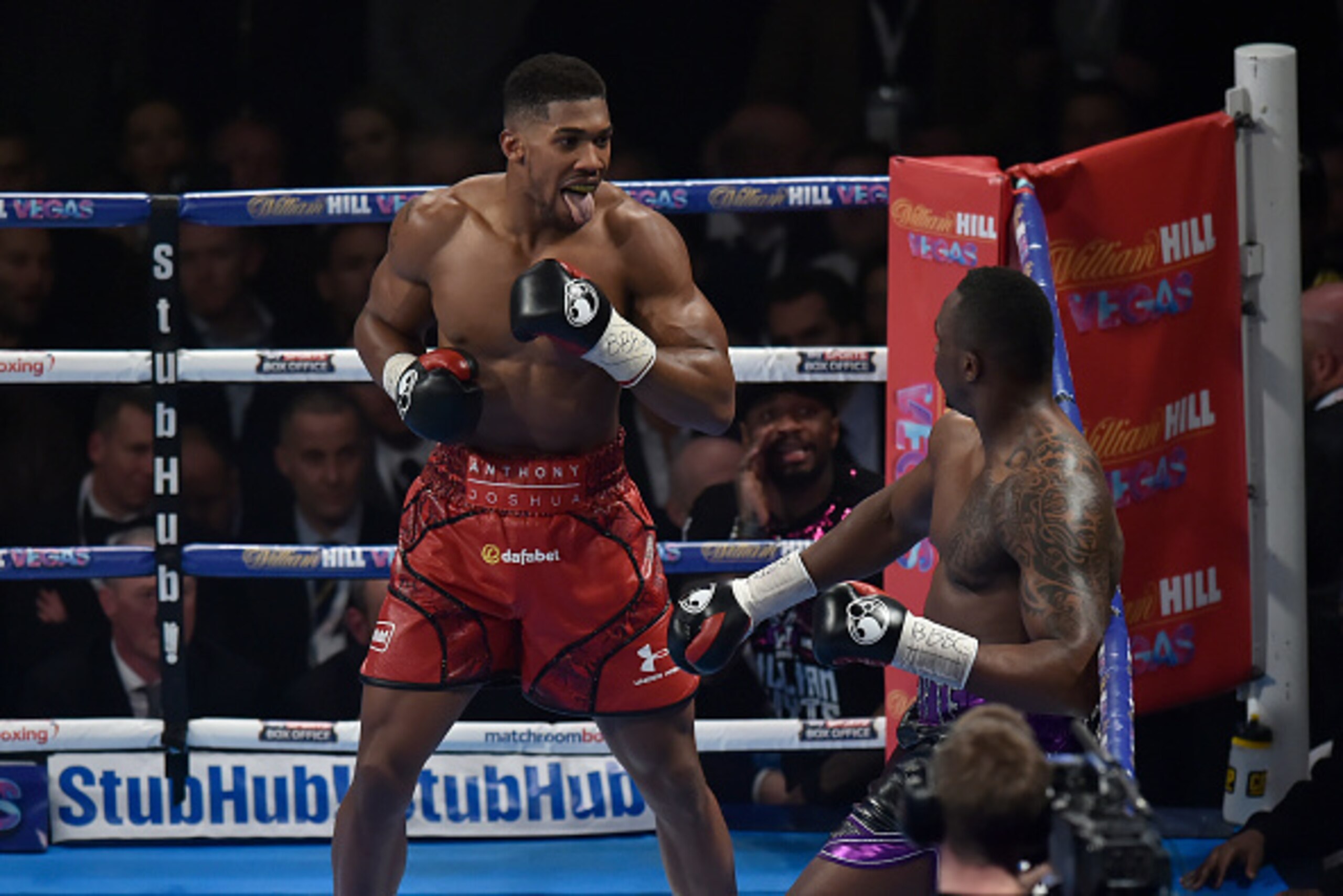 LONDON, ENGLAND - DECEMBER 12:  Anthony Joshua MBE (L) tries to intimidate Dillian Whyte during the Commonwealth Heavyweight title, Vacant British Heavyweight title and WBC International Heavyweight title fight at The O2 Arena on December 12, 2015 in Lond