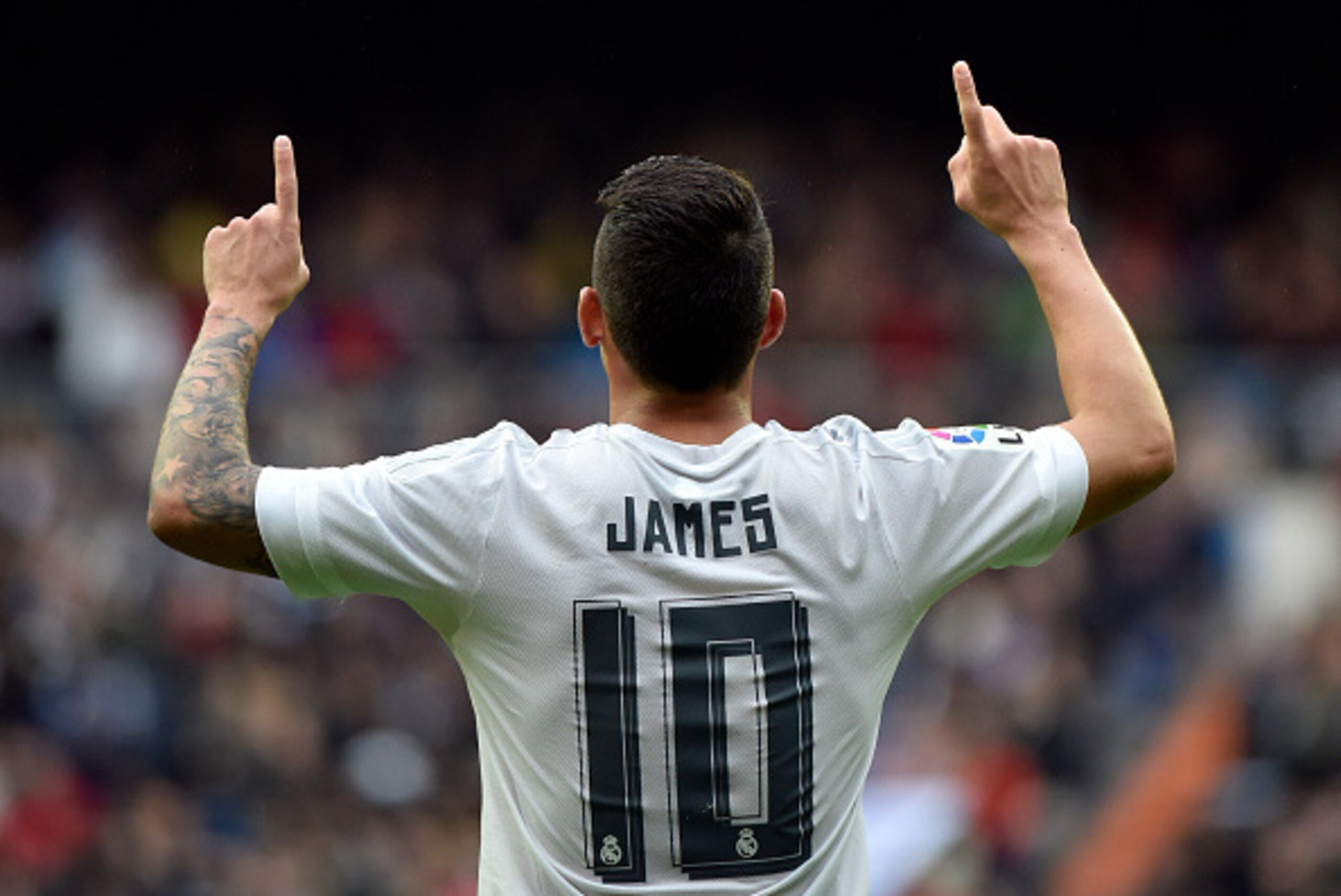 Real Madrid's Colombian midfielder James Rodriguez celebrates after scoring during the Spanish league football match Real Madrid CF vs Athletic Club Bilbao at the Santiago Bernabeu stadium in Madrid on February 13, 2016. / AFP / GERARD JULIEN        (Phot