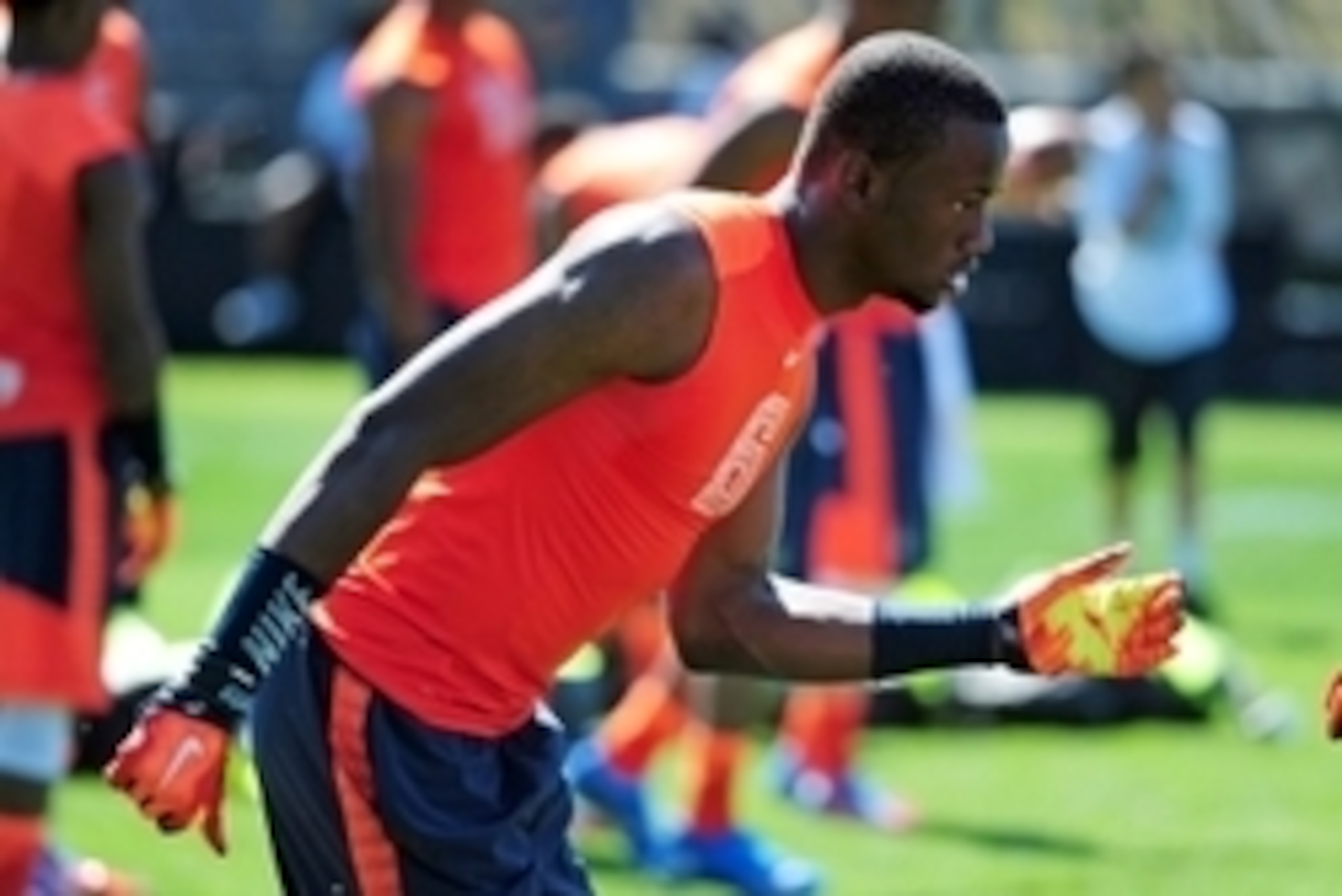 Jul 9, 2014; Beaverton, OR, USA; Alpha Pro athlete Torrance Gibson (6) heads off the line of scrimmage during Nike Football ' The Opening' at Nike World Headquarters. Mandatory Credit: Steve Dykes-USA TODAY Sports