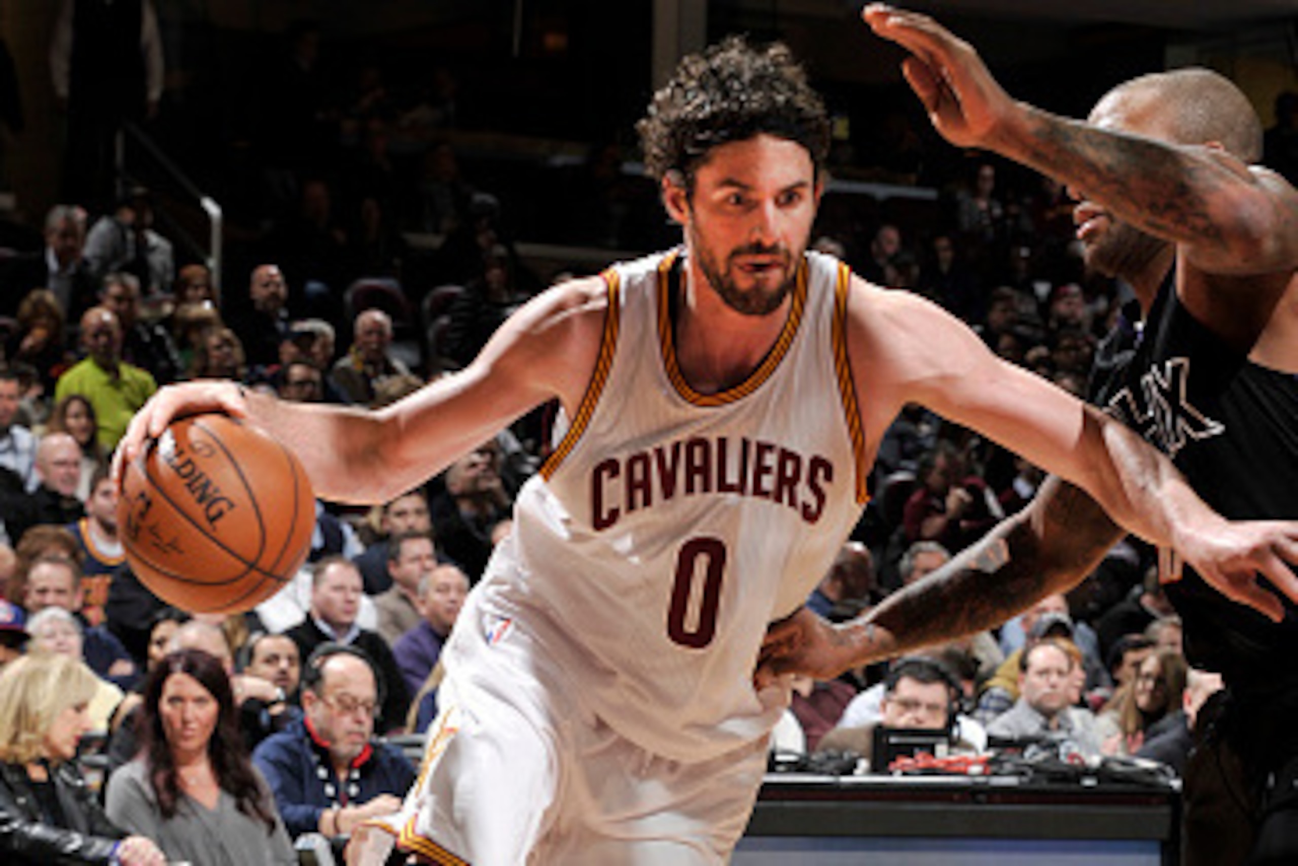 CLEVELAND, OH - JANUARY 27:  Kevin Love #0 of the Cleveland Cavaliers drives to the basket against the Phoenix Suns on January 27, 2016 at Quicken Loans Arena in Cleveland, Ohio. NOTE TO USER: User expressly acknowledges and agrees that, by downloading an