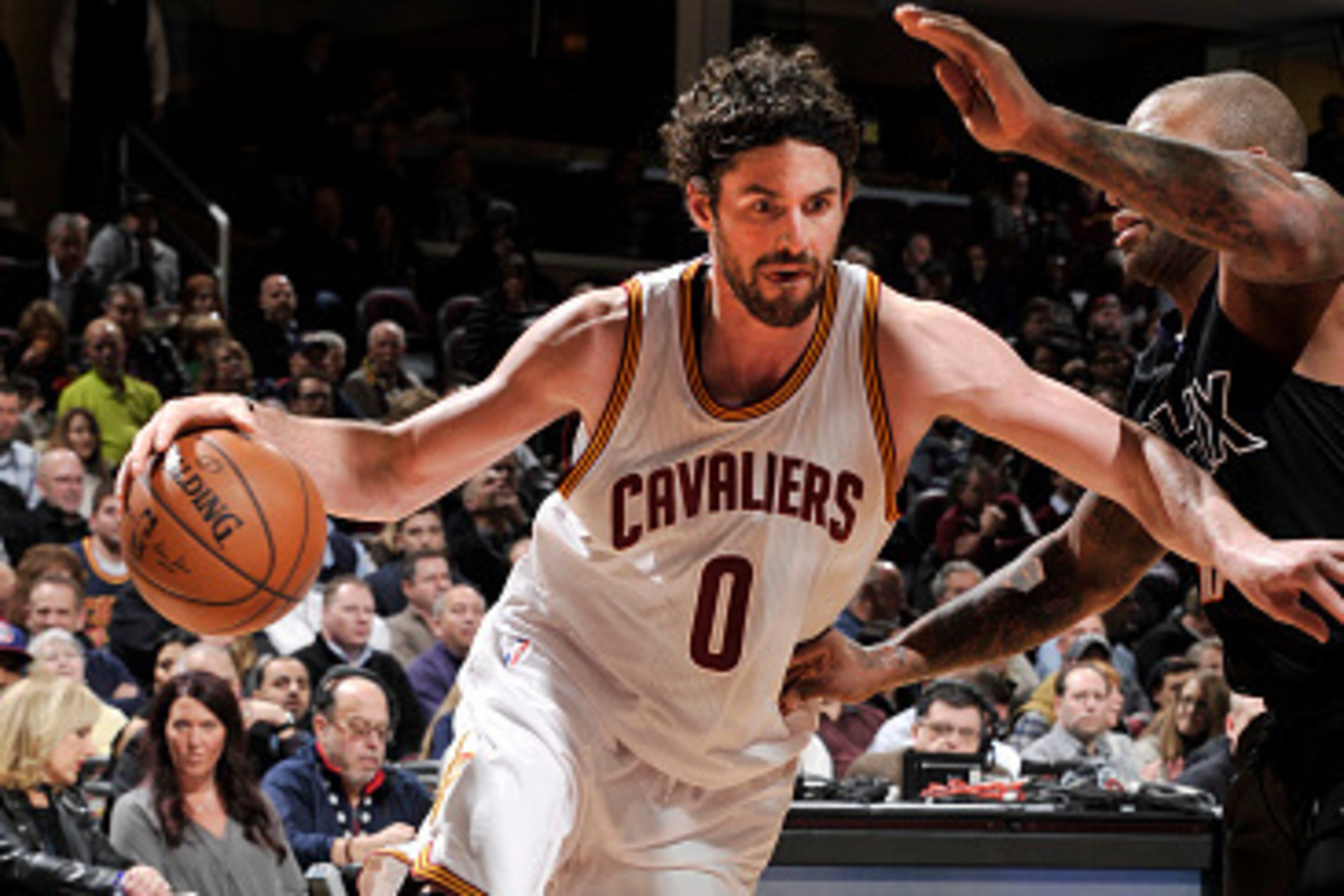 CLEVELAND, OH - JANUARY 27:  Kevin Love #0 of the Cleveland Cavaliers drives to the basket against the Phoenix Suns on January 27, 2016 at Quicken Loans Arena in Cleveland, Ohio. NOTE TO USER: User expressly acknowledges and agrees that, by downloading an