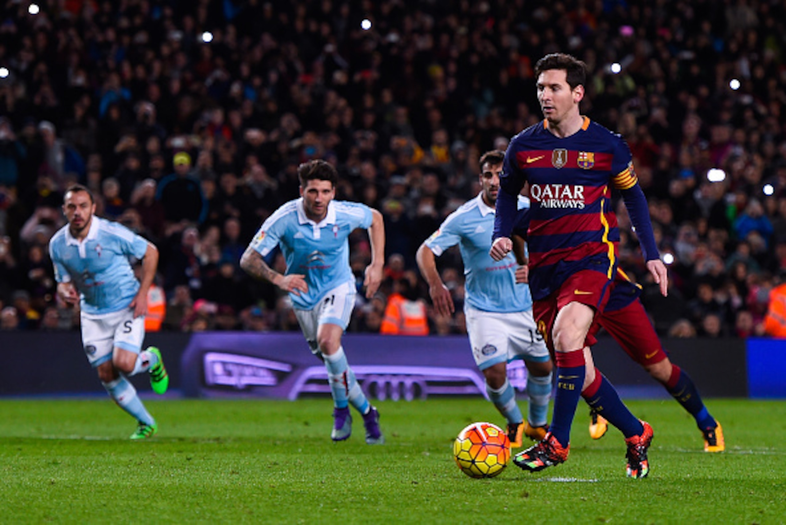 BARCELONA, SPAIN - FEBRUARY 14: Lionel Messi of FC Barcelona passes to his teammate Luis Suarez of FC Barcelona from the penalty spot to scores his team's fourth goal during the La Liga match between FC Barcelona and Celta Vigo at Camp Nou on February 14 BARCELONA, SPAIN - FEBRUARY 14: Lionel Messi of FC Barcelona passes to his teammate Luis Suarez of FC Barcelona from the penalty spot to scores his team's fourth goal during the La Liga match between FC Barcelona and Celta Vigo at Camp Nou on February 14