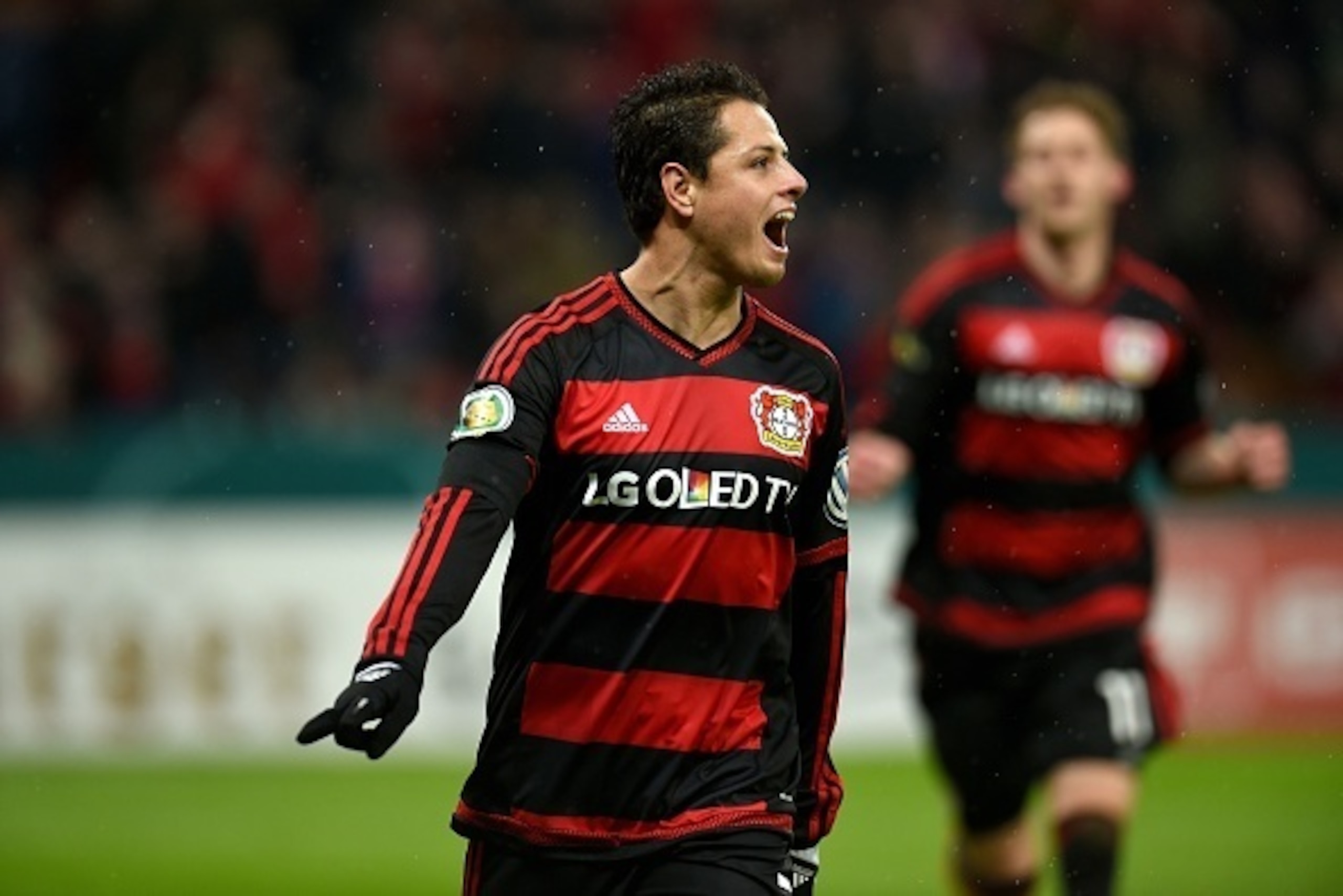Leverkusen's Mexican striker Javier Hernandez celebrates after a goal during the German Cup (Pokal) quarter final football match Bayern 04 Leverkusen v SV Werder Bremen on February 9, 2016 in Leverkusen.
  / AFP / PATRIK STOLLARZ / RESTRICTIONS: ACCORDING