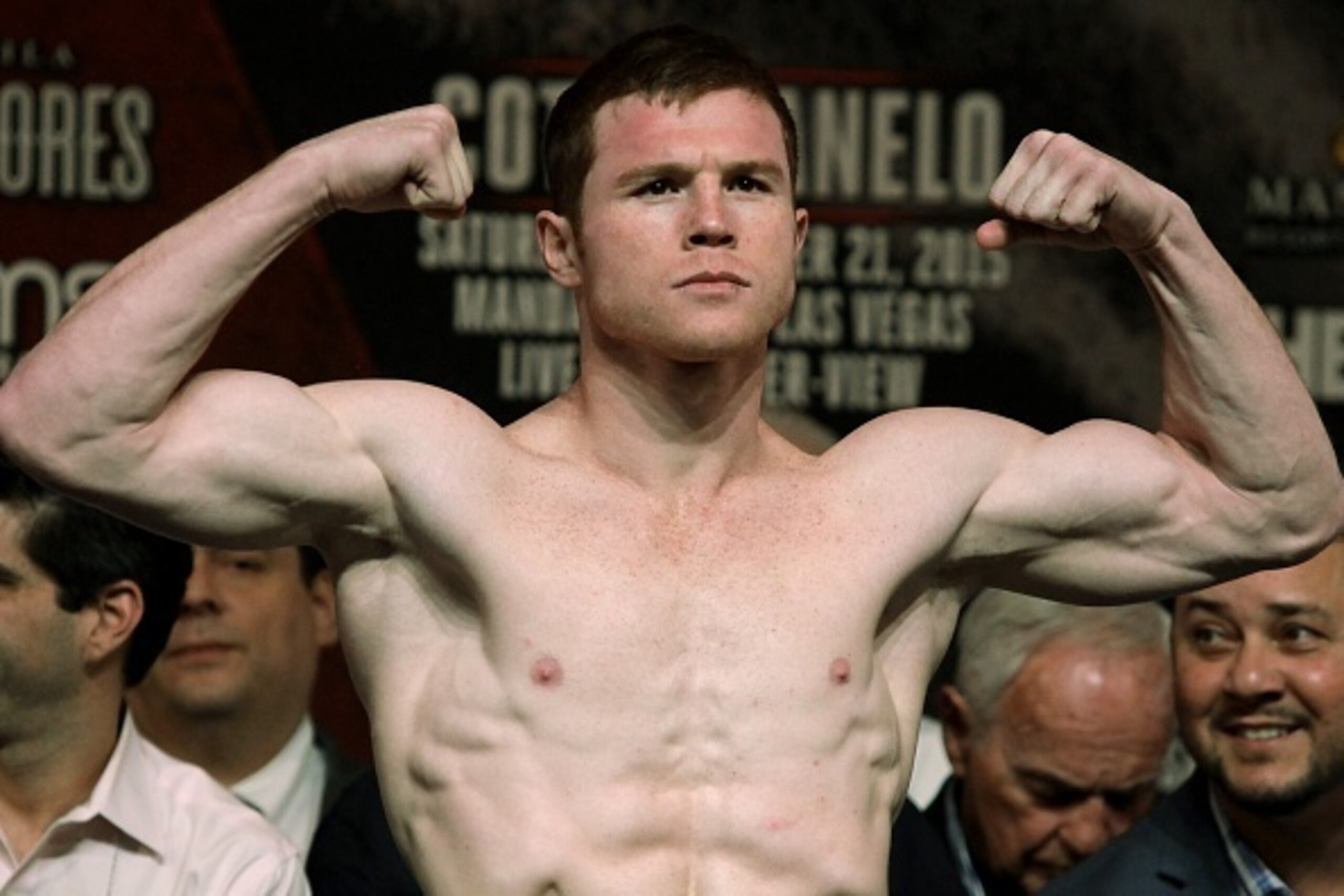 Mexico's Saul 'Canelo' Alvarez  gestures  during a weigh-in with former WBC Middleweight World Champion Miguel Cotto from Puerto Rico (unseen) in Las Vegas, Nevada on November 20, 2015.  Puerto Rican middleweight great Cotto says he doesn't need a world t