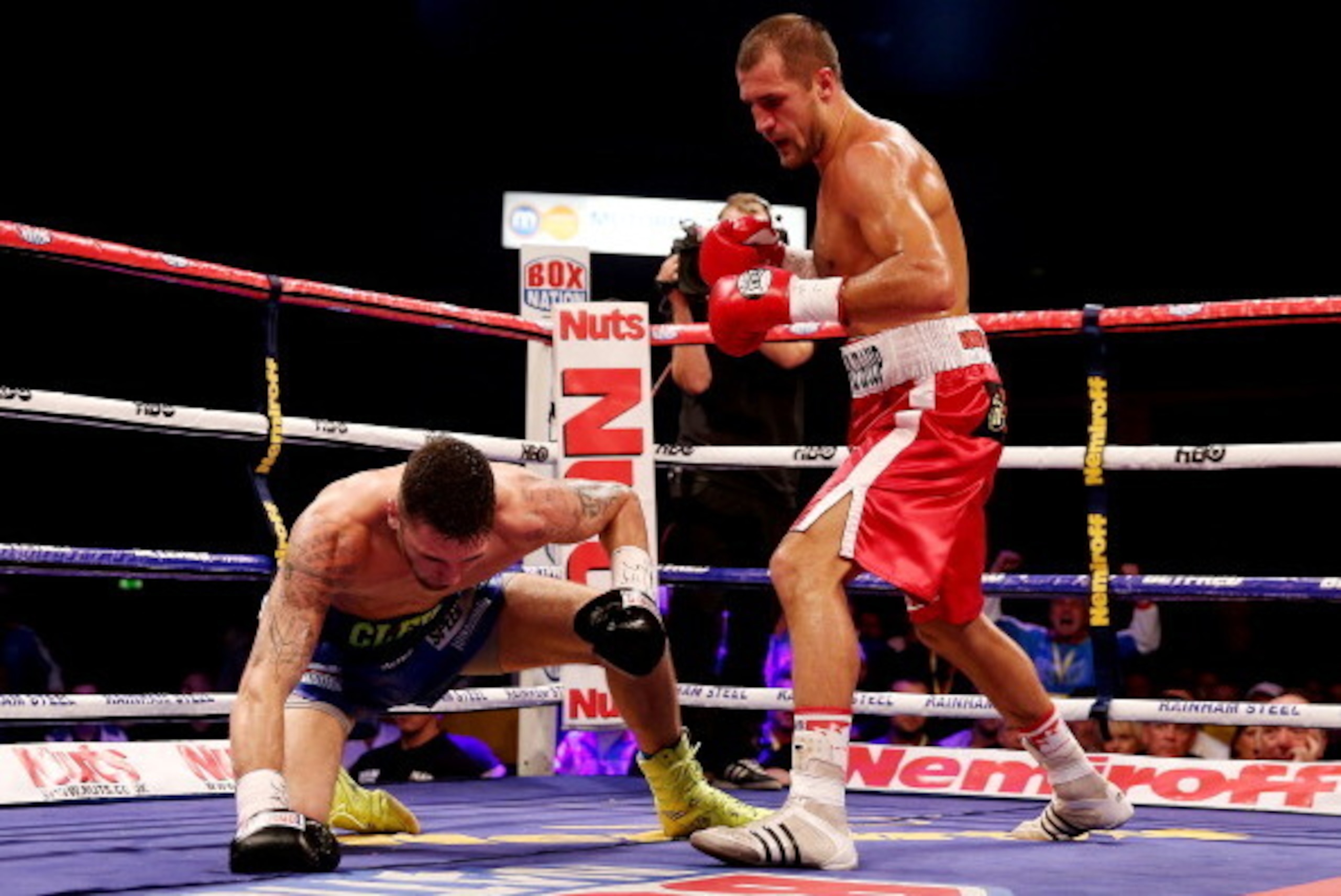 CARDIFF, WALES - AUGUST 17:  Nathan Cleverly is knocked down by Sergey Kovalev during the WBO World Light-Heavyweight Championship bout at Motorpoint Arena on August 17, 2013 in Cardiff, Wales.  (Photo by Scott Heavey/Getty Images)