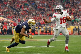 GLENDALE, AZ - JANUARY 01:  Quarterback J.T. Barrett #16 of the Ohio State Buckeyes scrambles with the football against the Notre Dame Fighting Irish during the BattleFrog Fiesta Bowl at University of Phoenix Stadium on January 1, 2016 in Glendale, Arizon