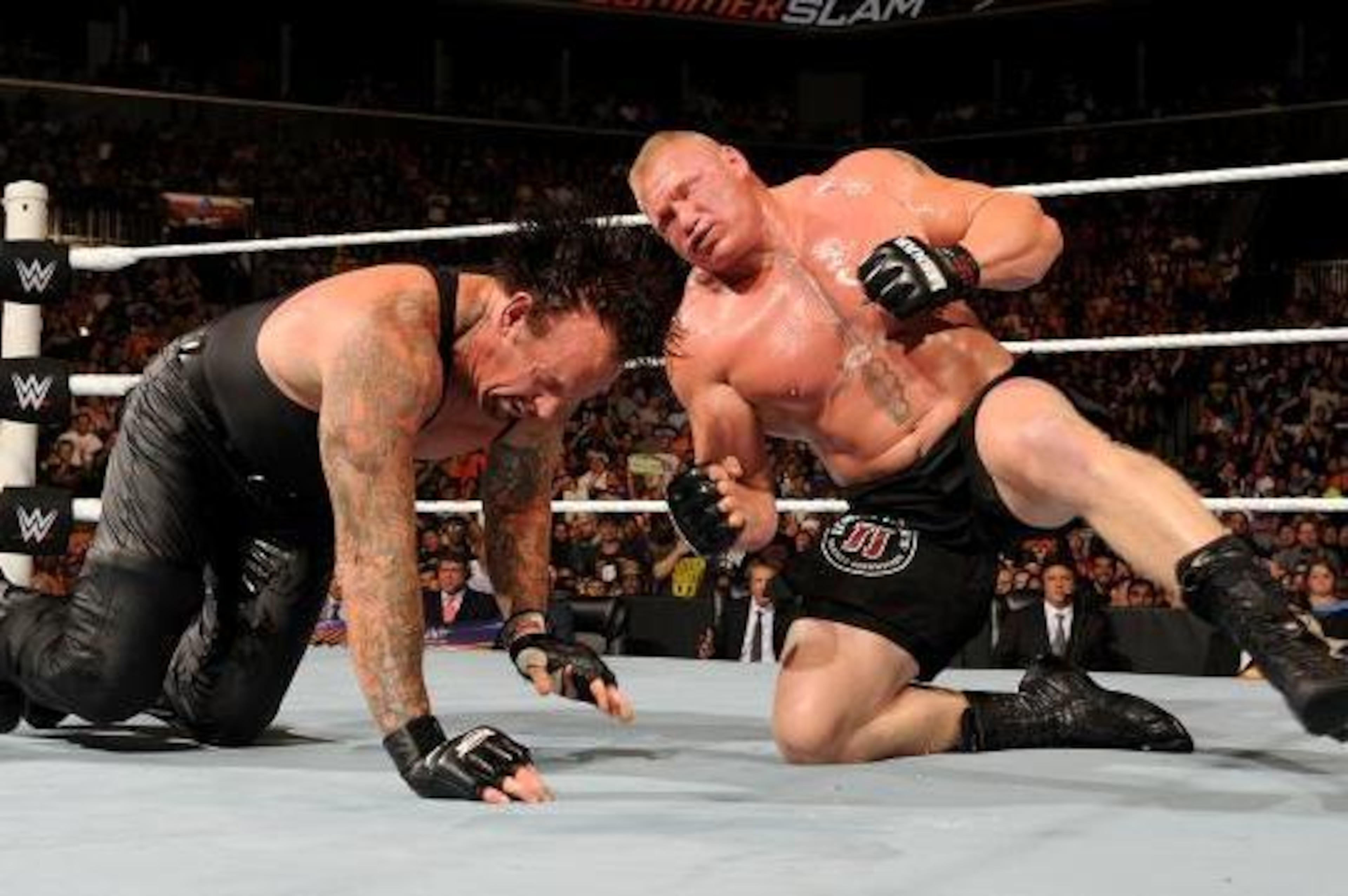 Brock Lesnar attacks Undertaker at SummerSlam.