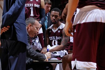 KNOXVILLE, TN - JANUARY 9:   Coach Billy Kennedy of the Texas A&M Aggies coaches in the huddle in a game at Thompson-Boling Arena on January 9, 2016 in Knoxville, Tennessee.  (Photo by Patrick Murphy-Racey/Getty Images)